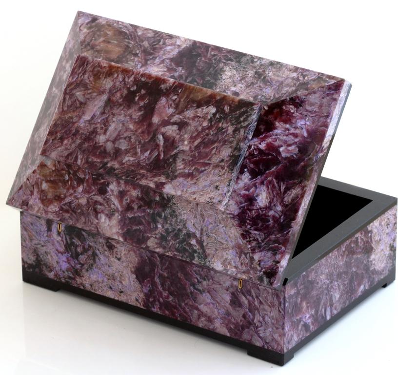 Invite healing energy into your home with an exquisite purple lilac Charoite box. This box is beautifully made with a hinged lid and expert construction. Lined in black velvet with black marble trims. Finished to a high polish to show off the