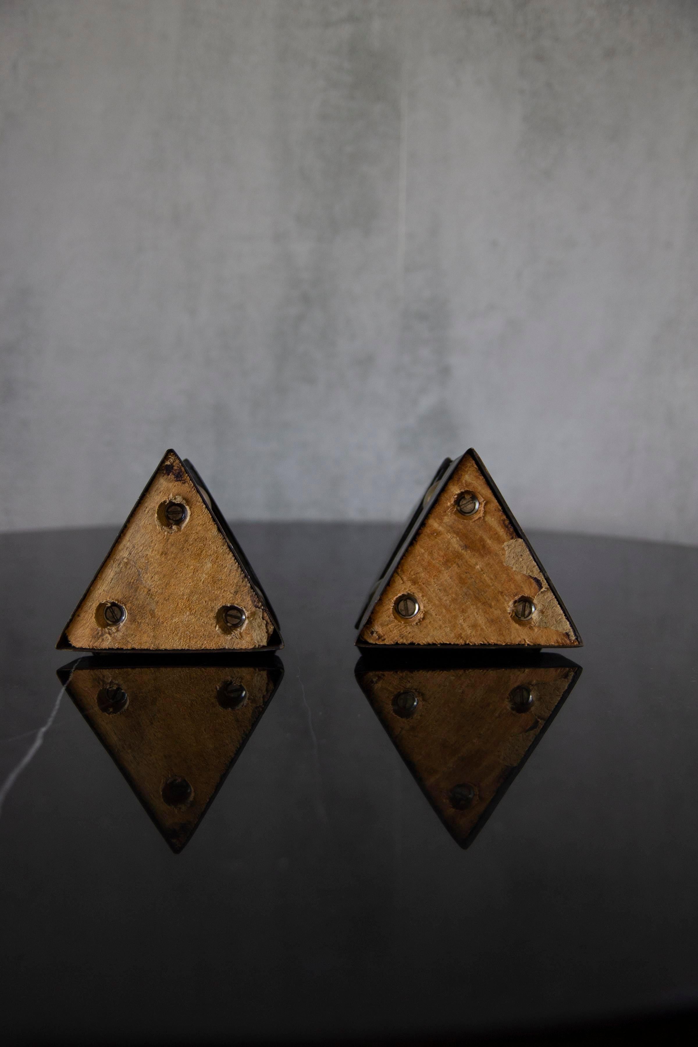 Pair of contemporary 'Pyramide' patinated brass.
Geometric sculptural shape, triangle shape supported by spherical plated brass. Perfect as a center piece for your living space.