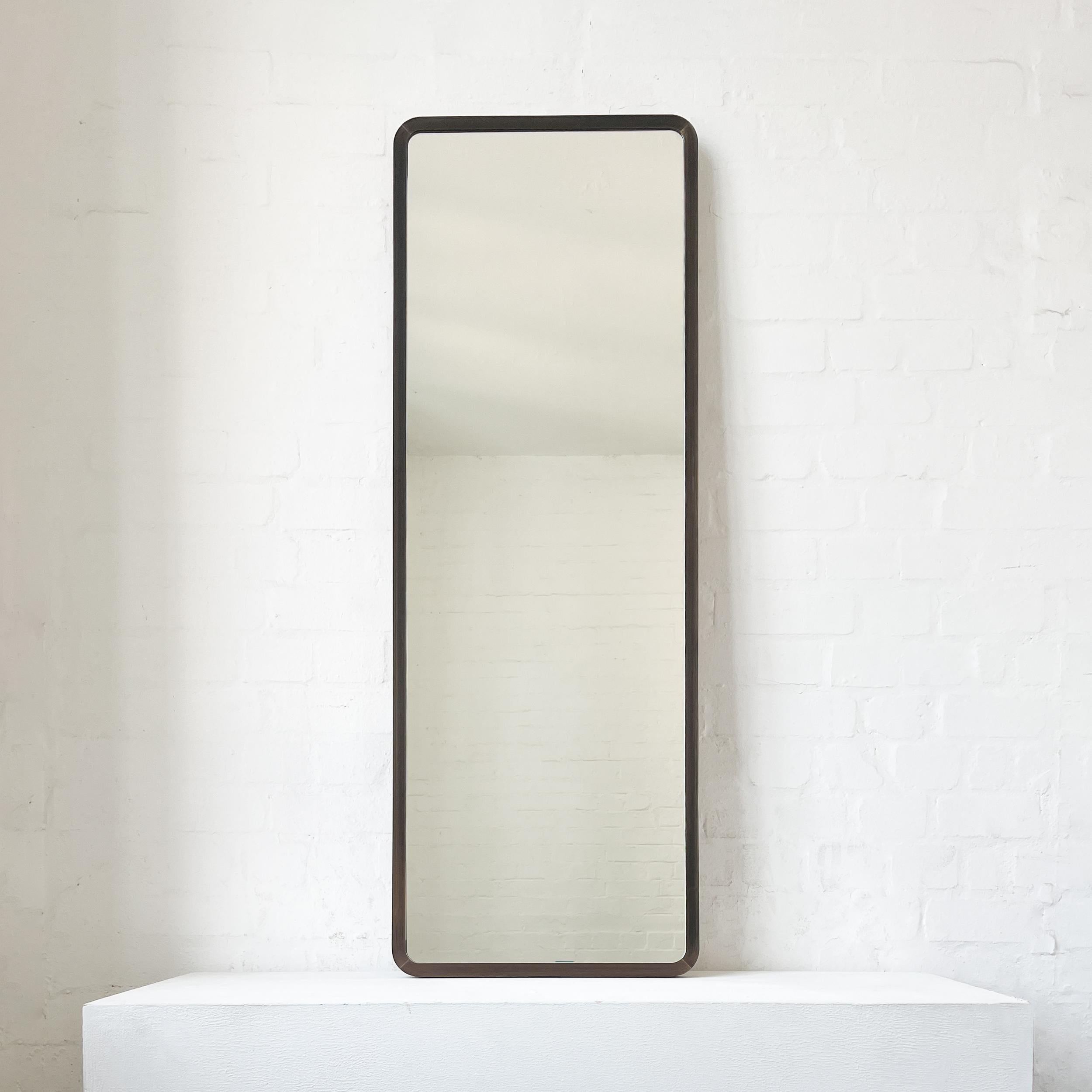 Modern ceiling suspended Quadris™ rectangular mirror with an exquisite  handcrafted brass frame with a bronze patina finish. Available individually or as a set. This mirror is fully customisable to suit the specific requirements of each interior.