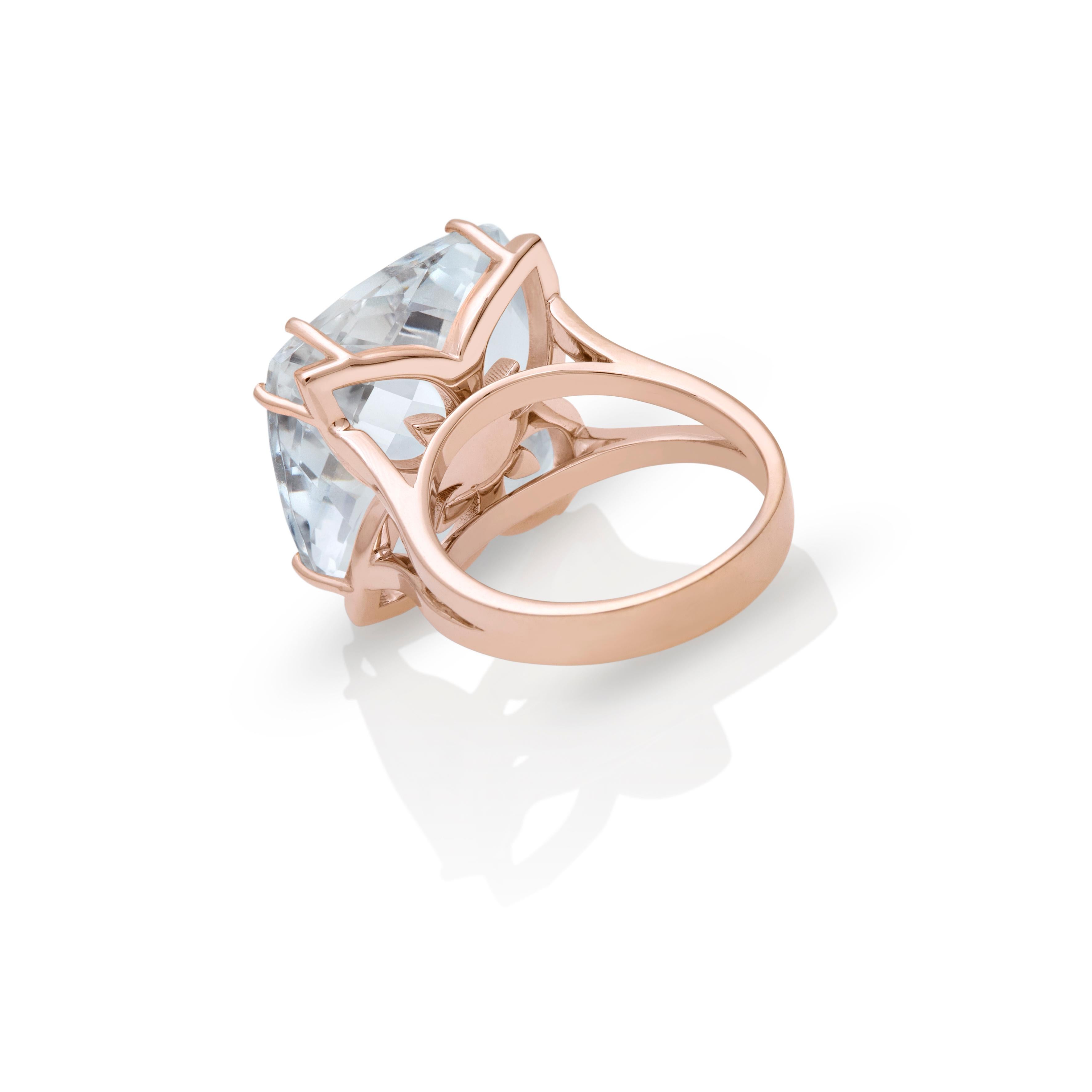 18kt Rose Gold Clear Royal Quartz ring 19.00 carat with Diamonds 0,08 ct Chakral Activator Ring by Nicofilimon.
An exquisite handcrafted 18kt gold with a royal quartz cushion briolette cut & diamonds ring that defines elegance and refined