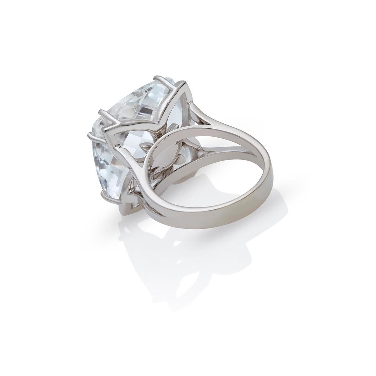 18kt White Gold Clear Royal Quartz ring 19.00 carat with Diamonds 0,08 ct Chakral Activator Ring by Nicofilimon.
An exquisite handcrafted 18kt white gold with a royal quartz cushion briolette cut & diamonds ring that defines elegance and refined