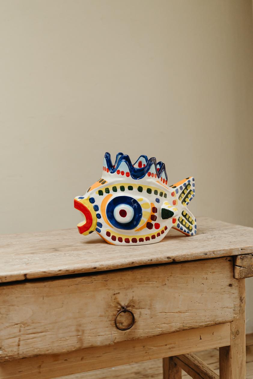 Quirky ceramic vase/urn in the form of a fish, lovely item to color your world. I use it in the kitchen as you can see.