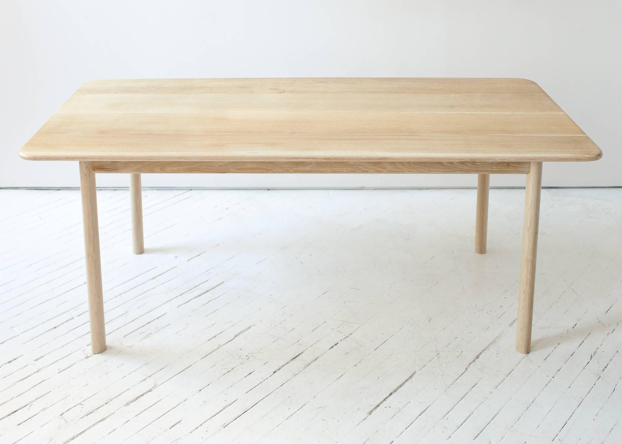 This visually light weight farm table features a thin hardwood top supported by a solid dowel leg frame. The simple structure maximizes usable seating space, while the round corners and edges provide an inviting place to gather.

The Shaker inspired