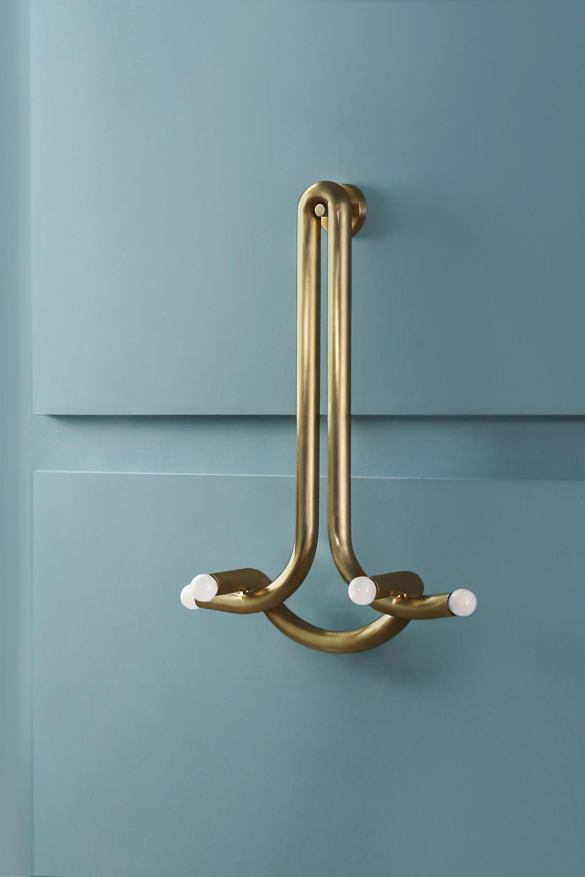 Contemporary Raw Brass Wall Sconce, God Sconce by Paul Matter

The God Sconce explores the relationship between two interlocked forms in perfect union and balance . A study of form and function that evokes the grace and strength of the contributor