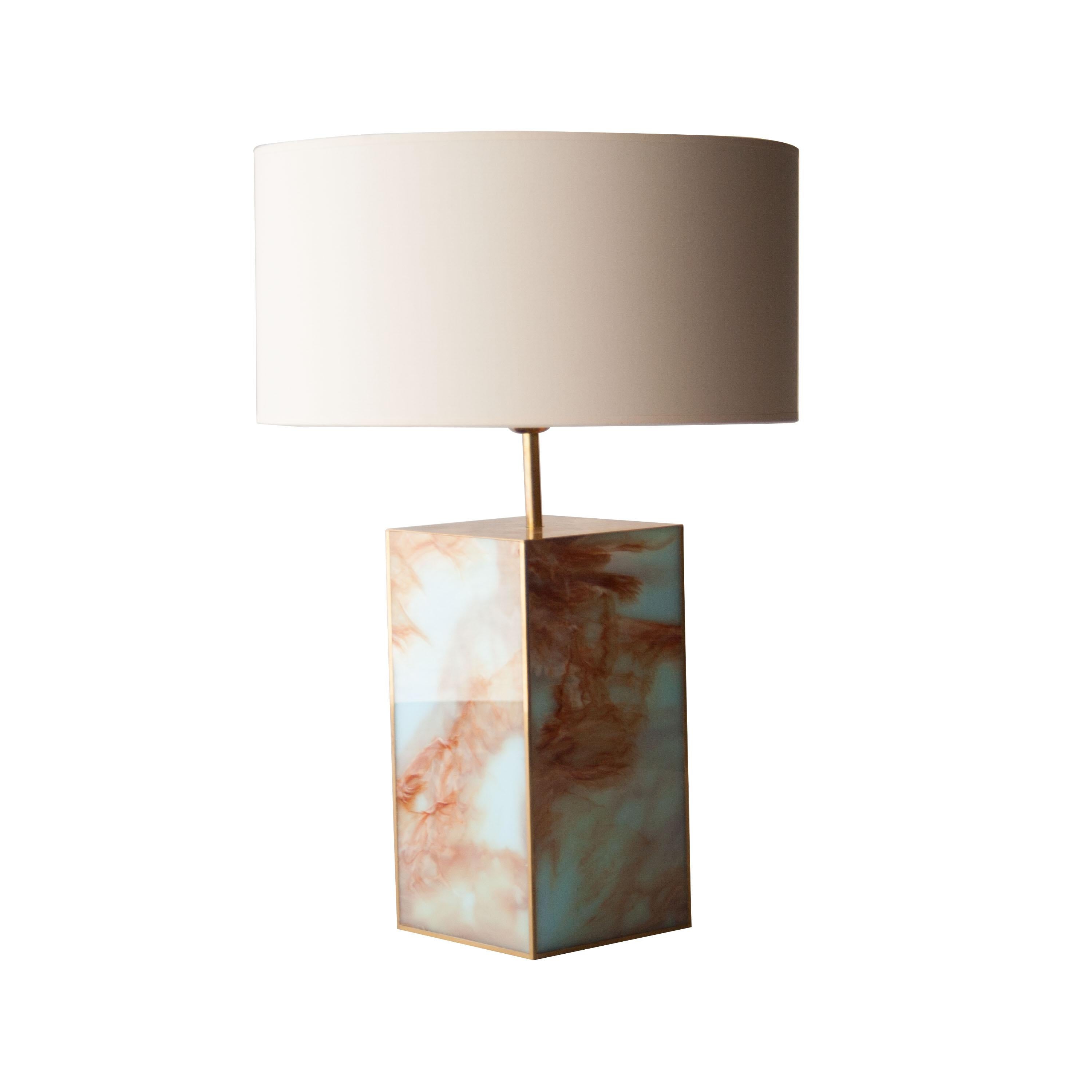 Pair of table handmade lamps with a methacrylate base colored in cyan and orange, with brass details and a beige screen.