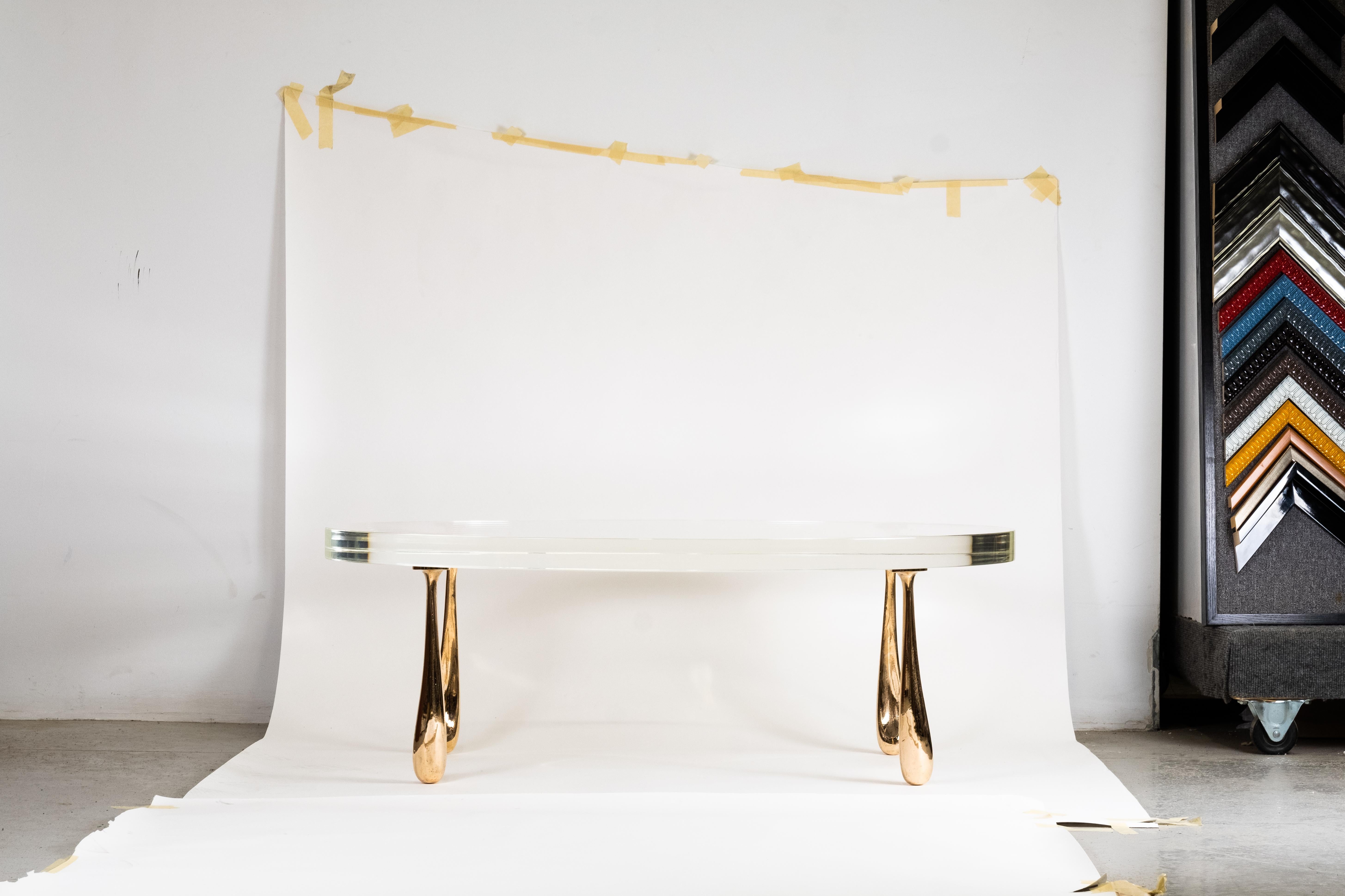 The Jupiter low table pairs STACKLAB’s signature solid-bronze Jupiter leg castings with an acrylic table top.

The Jupiter leg is a study in creating a completely asymmetrical, yet aesthetically cohesive, geometry. The shape derived digitally, is