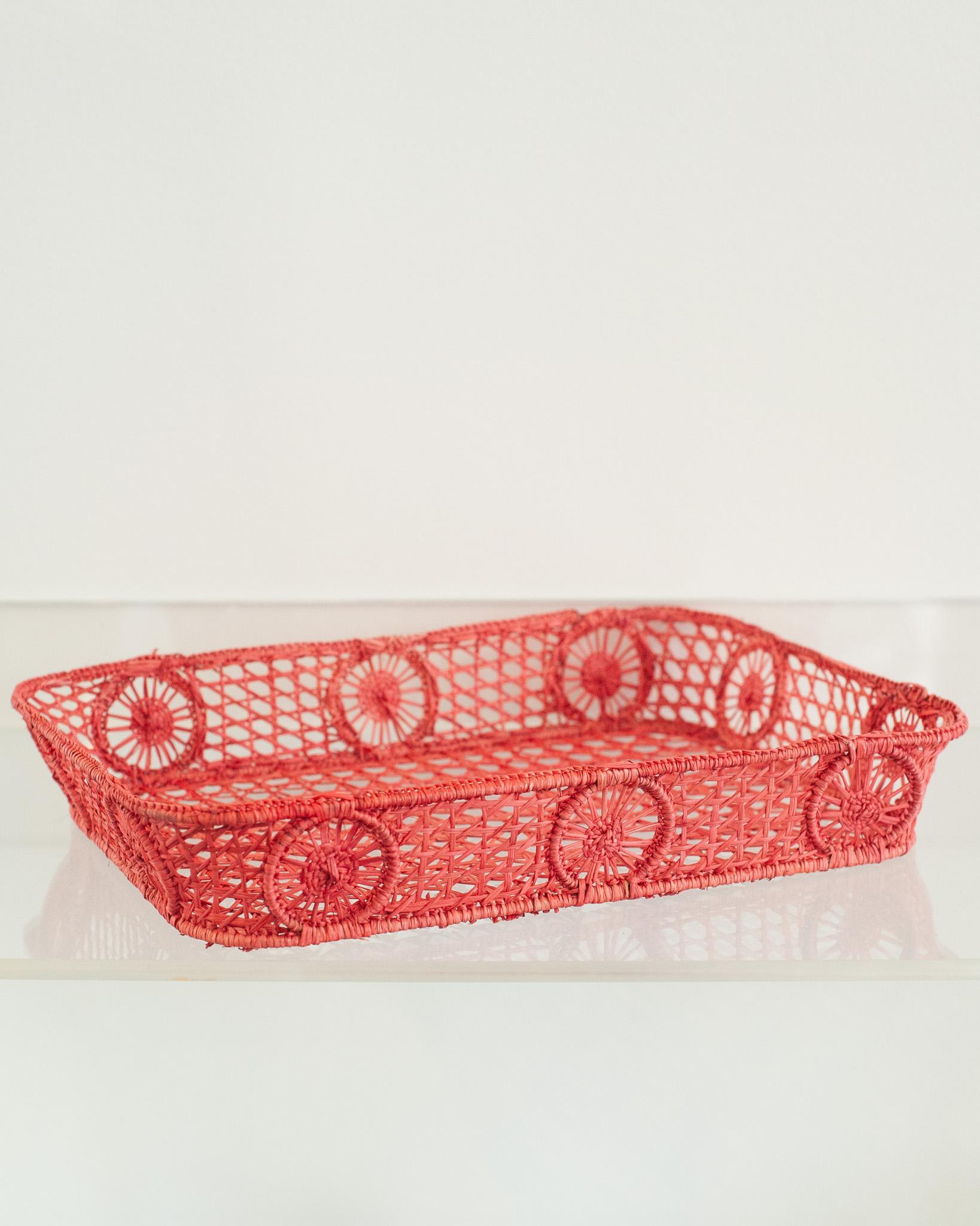 Uplift your table with this stunning handwoven rattan tray with rounded corners. Finely crafted by expert artisans, this piece showcases the classical technique of weaving in a modern way. From Jean Michel Frank to the House of Dior, rattan has