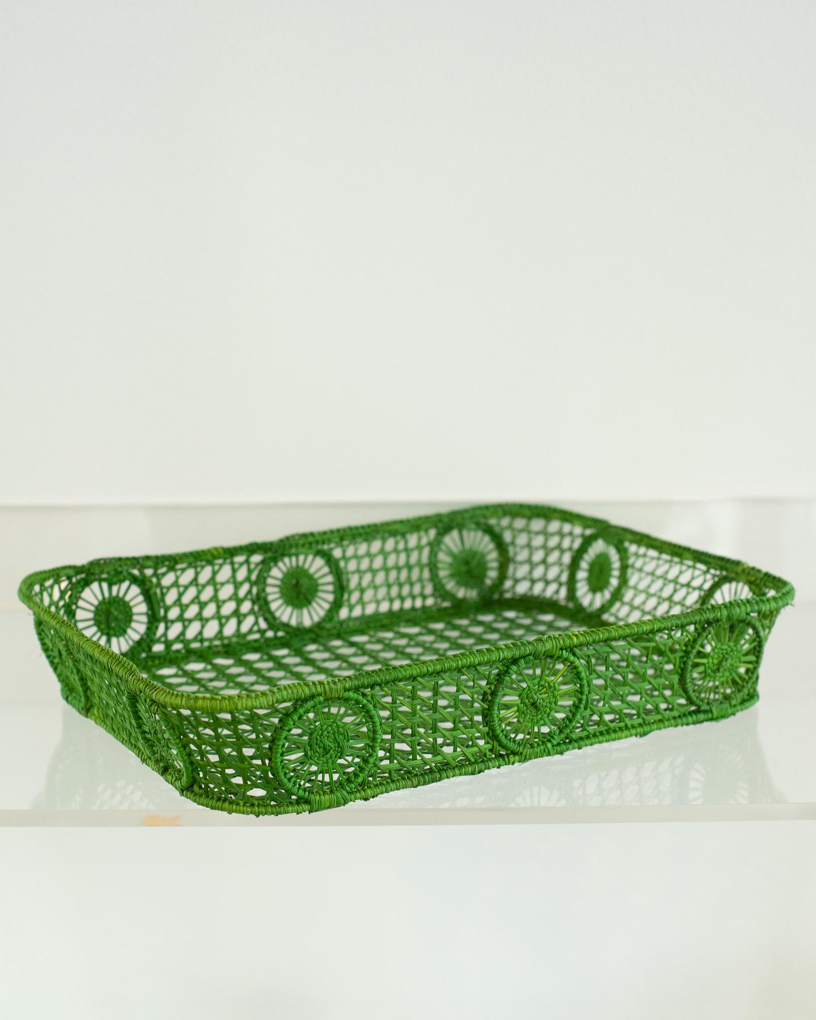 Uplift your table with this stunning handwoven rattan tray with rounded corners. Finely crafted by expert artisans, this piece showcases the classical technique of weaving in a modern way. From Jean Michel Frank to the House of Dior, rattan has