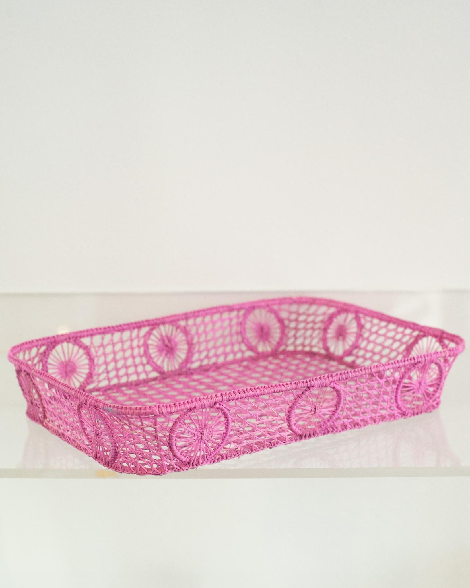 Uplift your table with this stunning handwoven rattan tray with rounded corners. Finely crafted by expert artisans, this piece showcases the classical technique of weaving in a modern way. From Jean Michel Frank to the House of Dior, rattan has