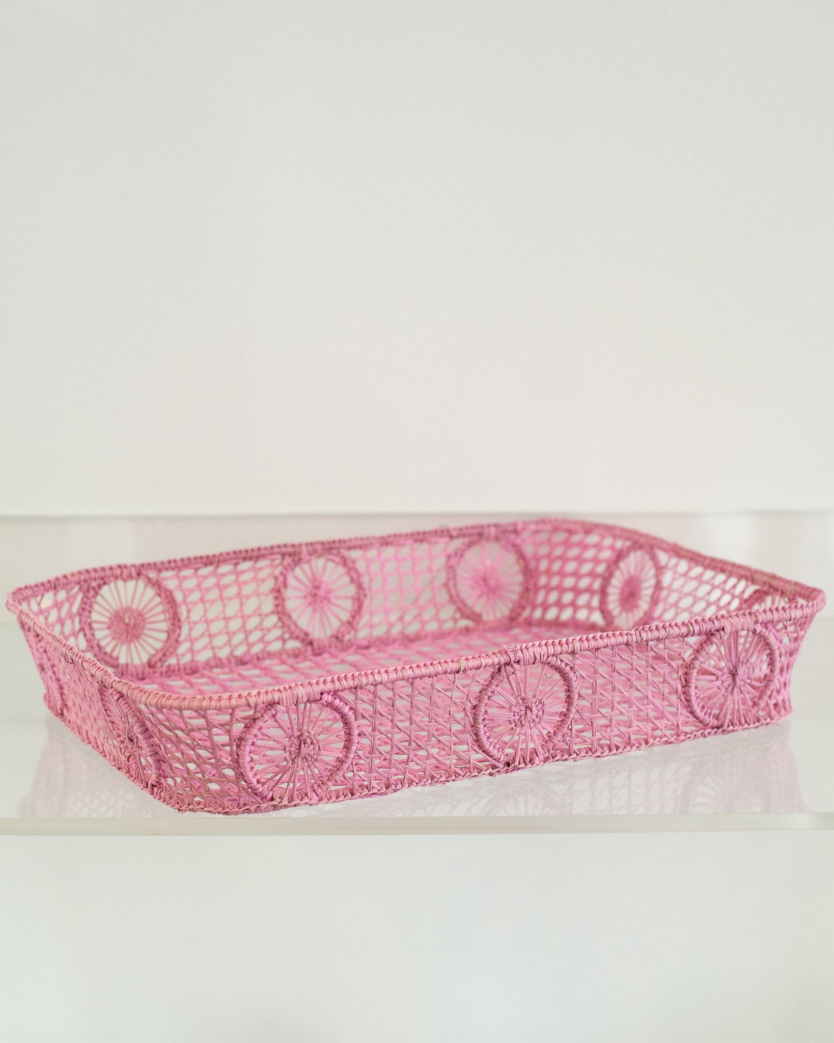 Uplift your table with this stunning handwoven rattan tray with rounded corners. Finely crafted by expert artisans, this piece showcases the classical technique of weaving in a modern way. From Jean Michel Frank to the House of Dior, rattan has