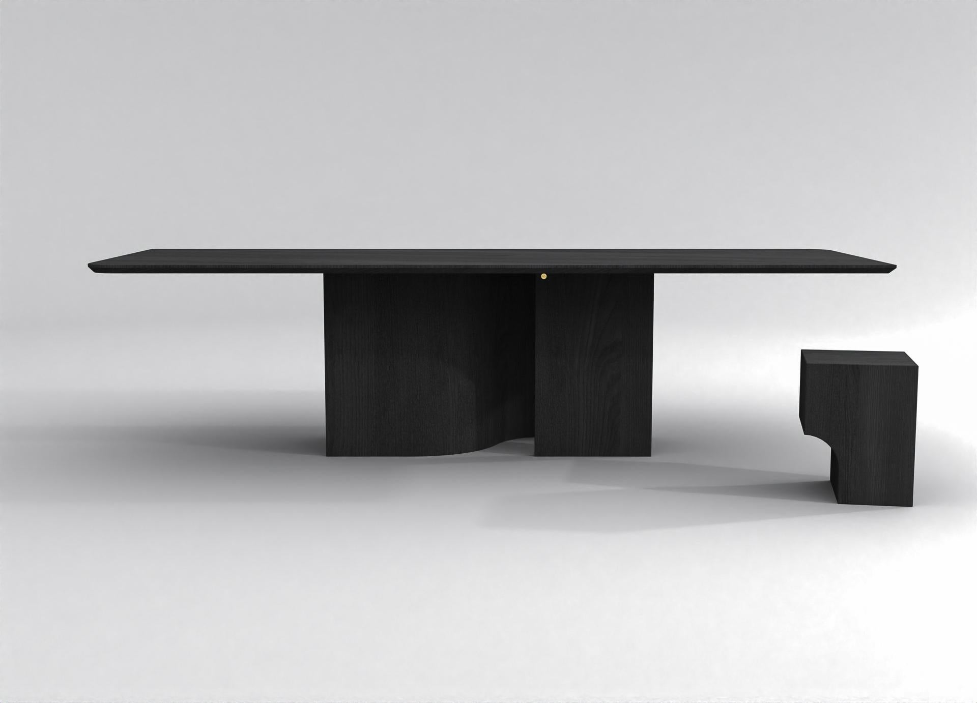 The barh shadow table is a minimalistic but very present design. The base plays with shadows and keeps you wondering what's behind. The depth that unfolds in the central leg creates a mysterious mood. Accentuated by the beautiful wood grain, the