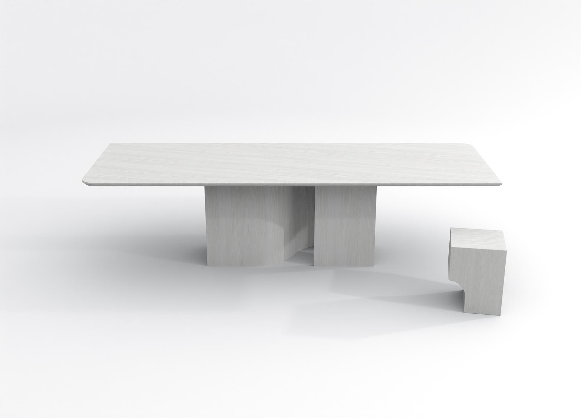 The barh shadow table is a minimalistic but very present design. The base plays with shadows and keeps you wondering what's behind. The depth that unfolds in the central leg creates a mysterious mood. Accentuated by the beautiful wood grain, the