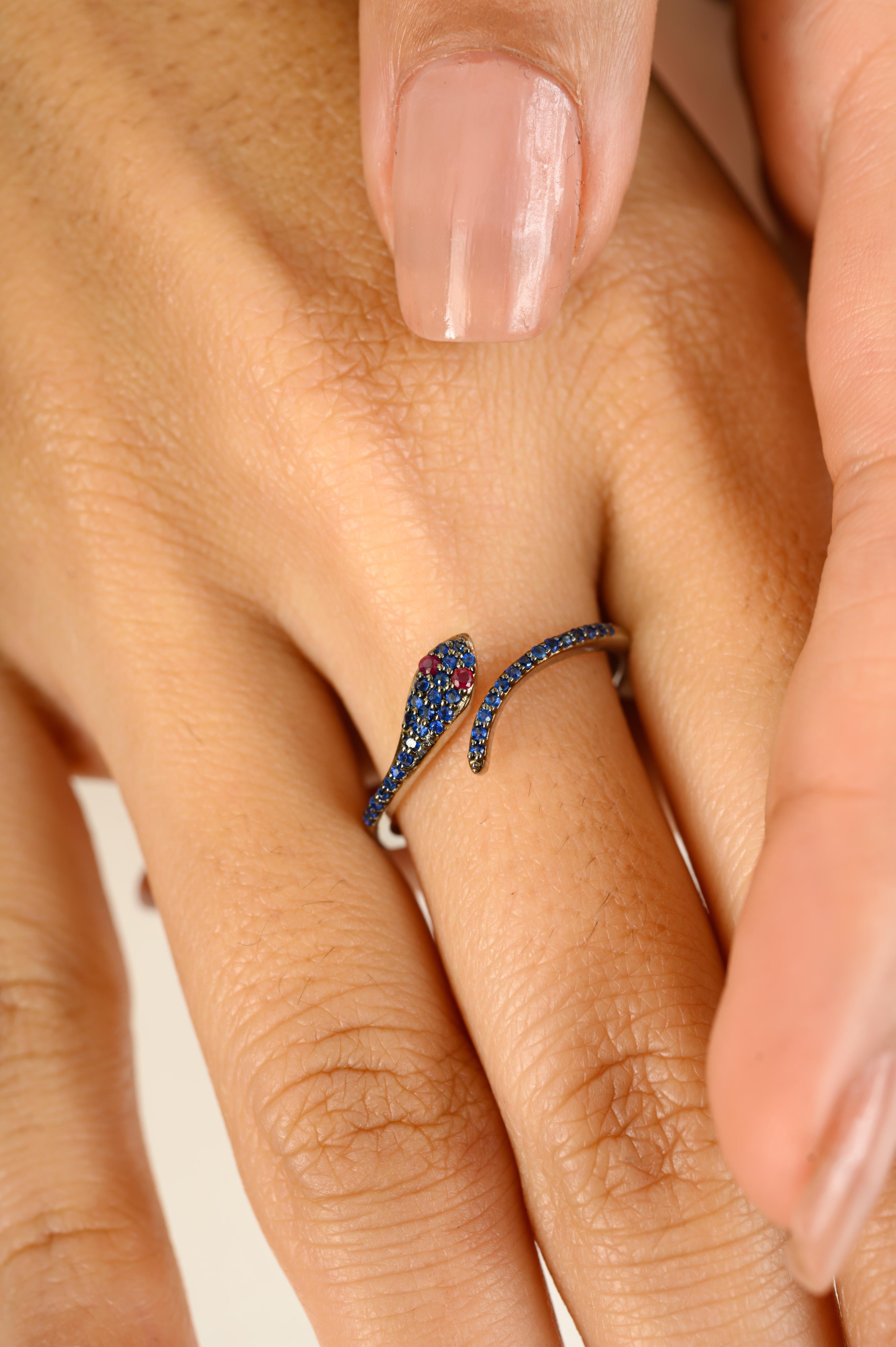 For Sale:  Contemporary Red Ruby Eye Pave Blue Sapphire Thin Snake Ring in 18k White Gold 2