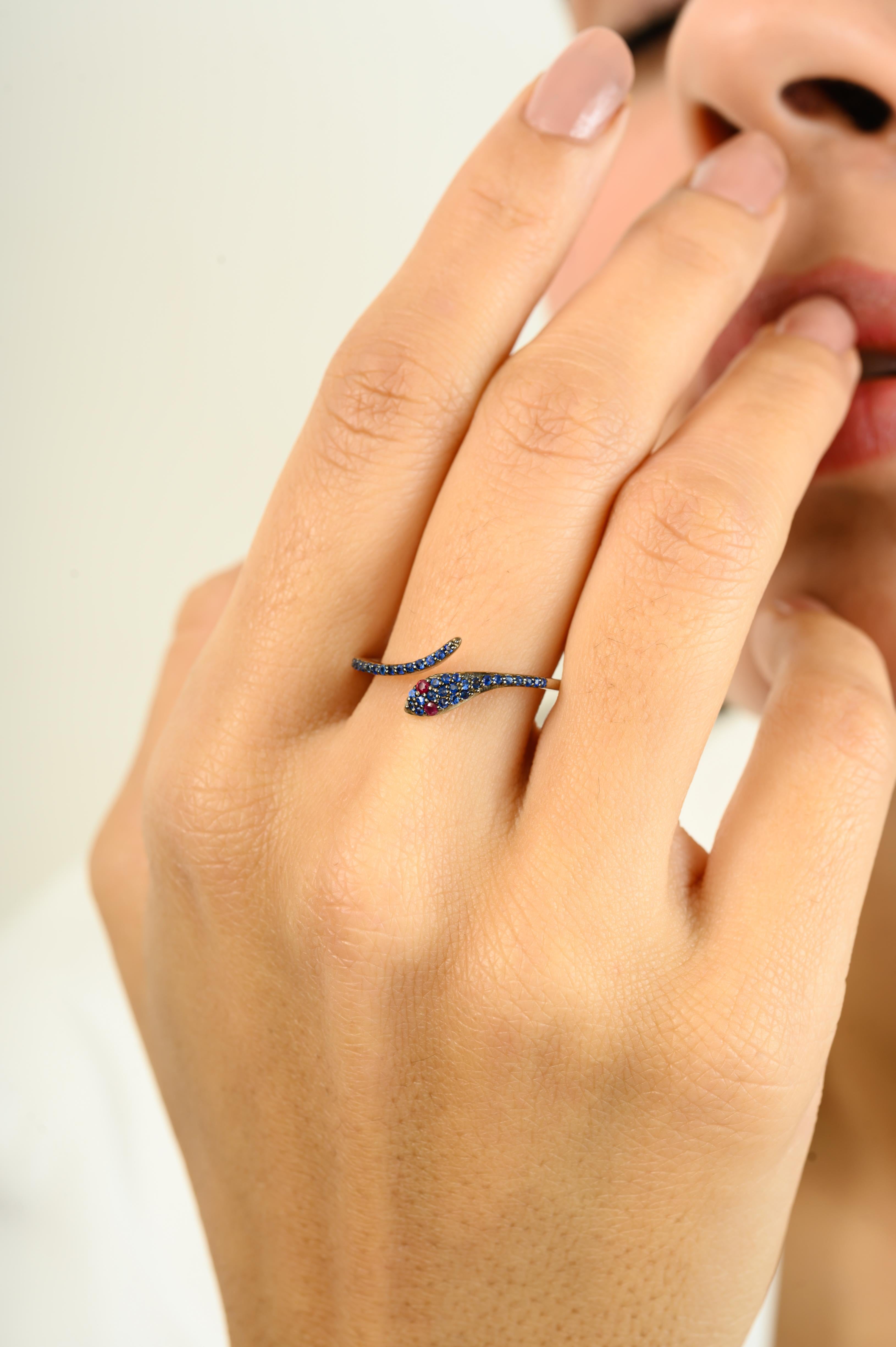For Sale:  Contemporary Red Ruby Eye Pave Blue Sapphire Thin Snake Ring in 18k White Gold 4