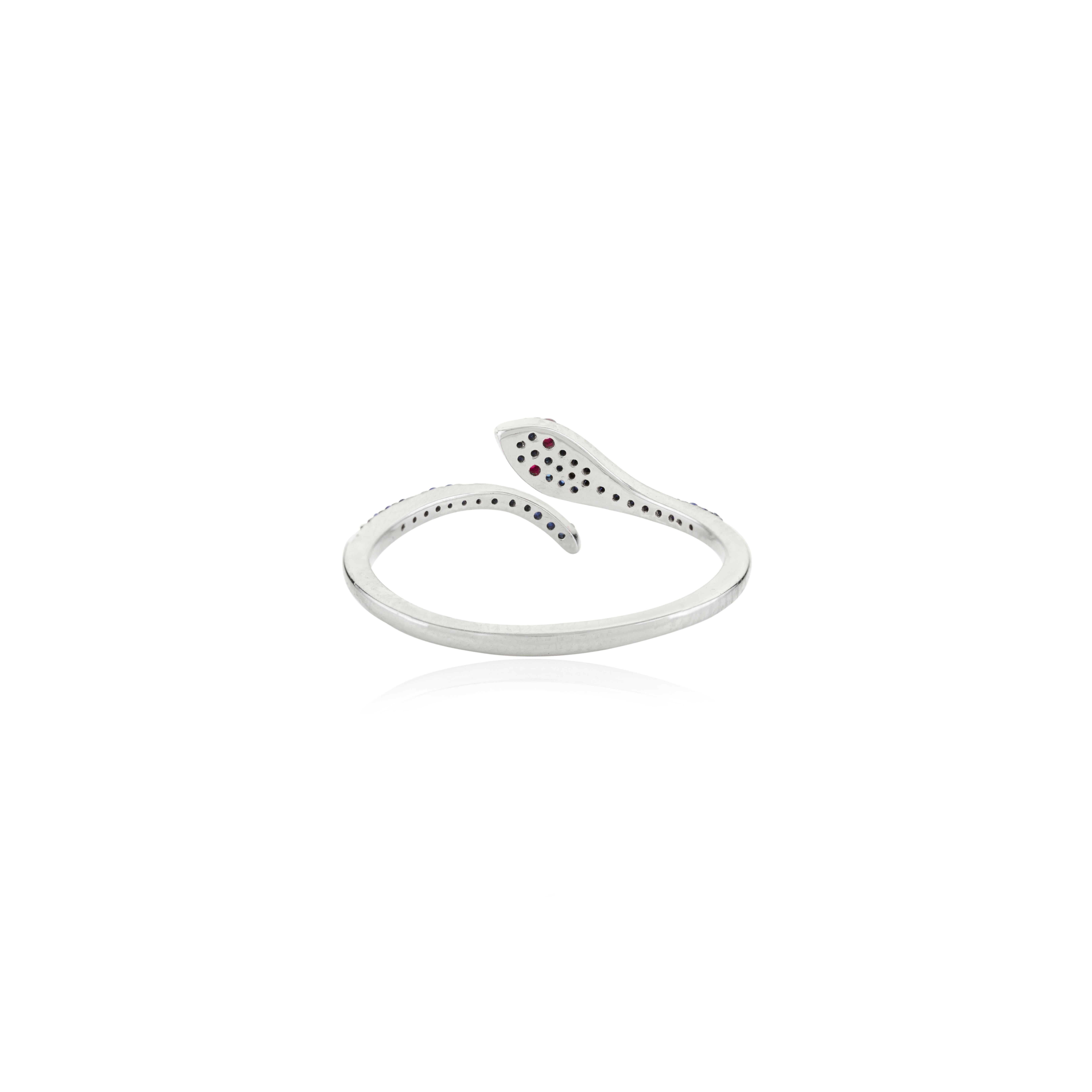 For Sale:  Contemporary Red Ruby Eye Pave Blue Sapphire Thin Snake Ring in 18k White Gold 7