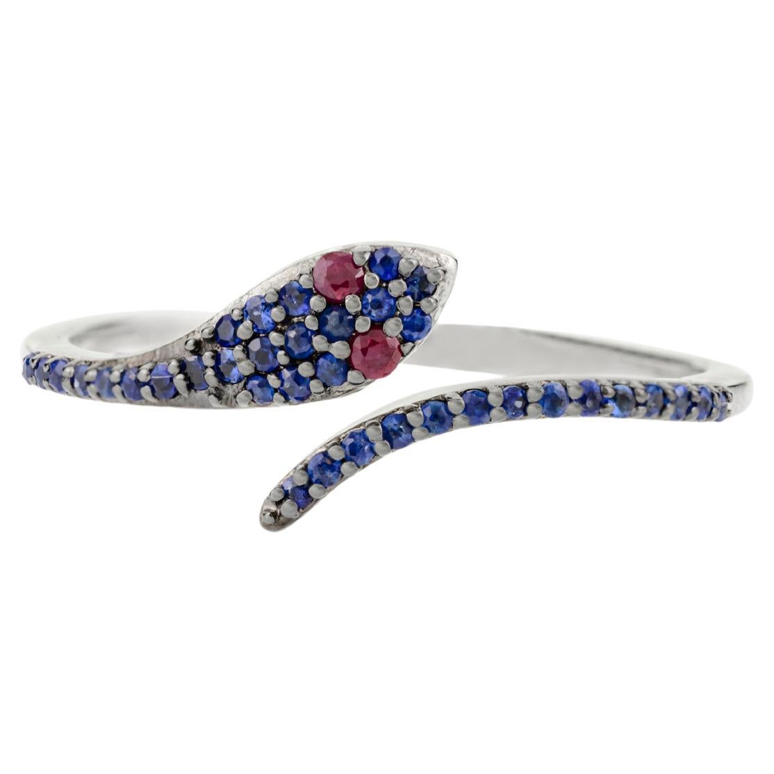 For Sale:  Contemporary Red Ruby Eye Pave Blue Sapphire Thin Snake Ring in 18k White Gold
