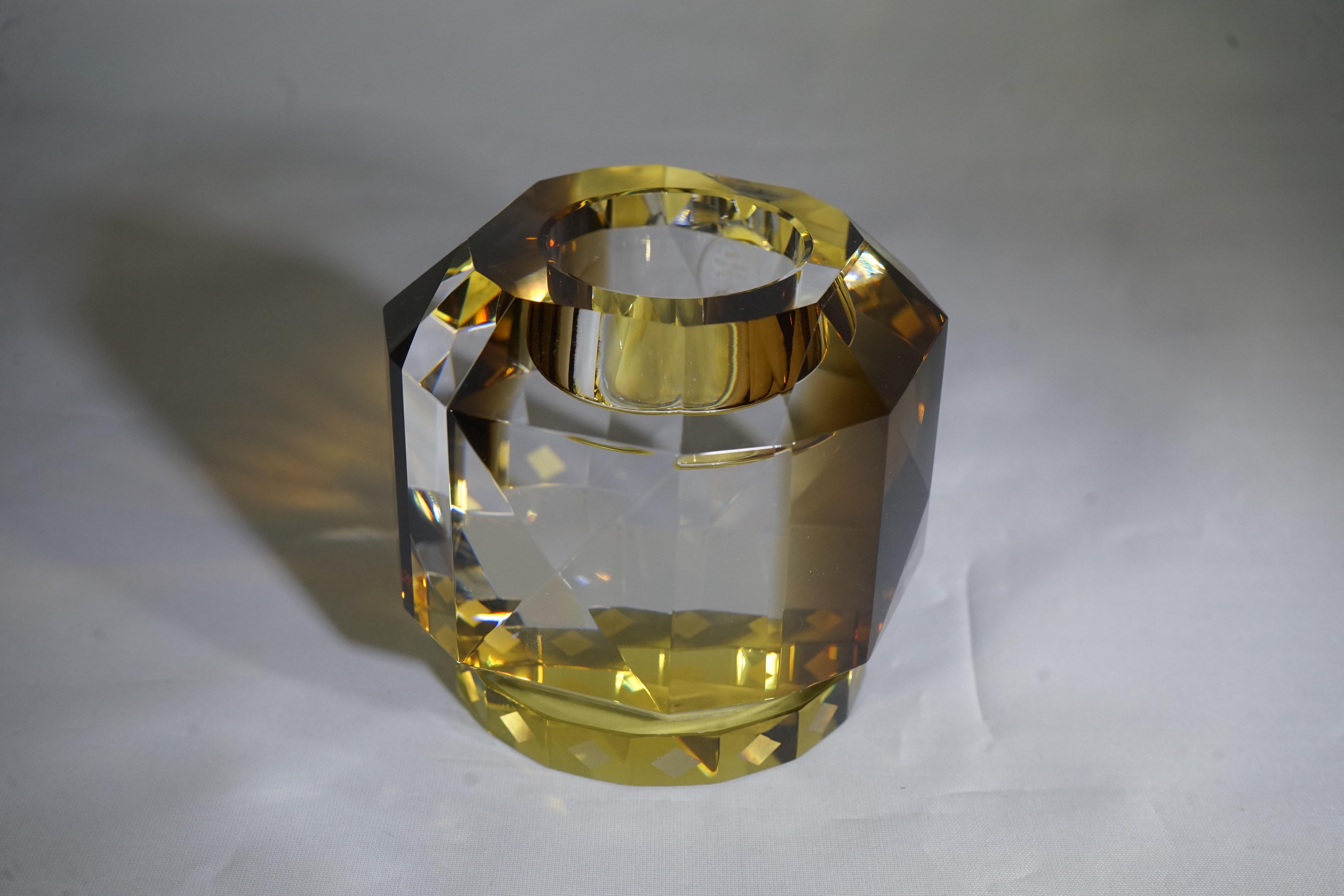 Reflections Copenhagen handcut brown and yellow crystal Texas T-light holder from designers Julie Hugau and Andrea Larsson. The candleholder showcases reflections Copenhagen's signature geometric shapes and wedges.