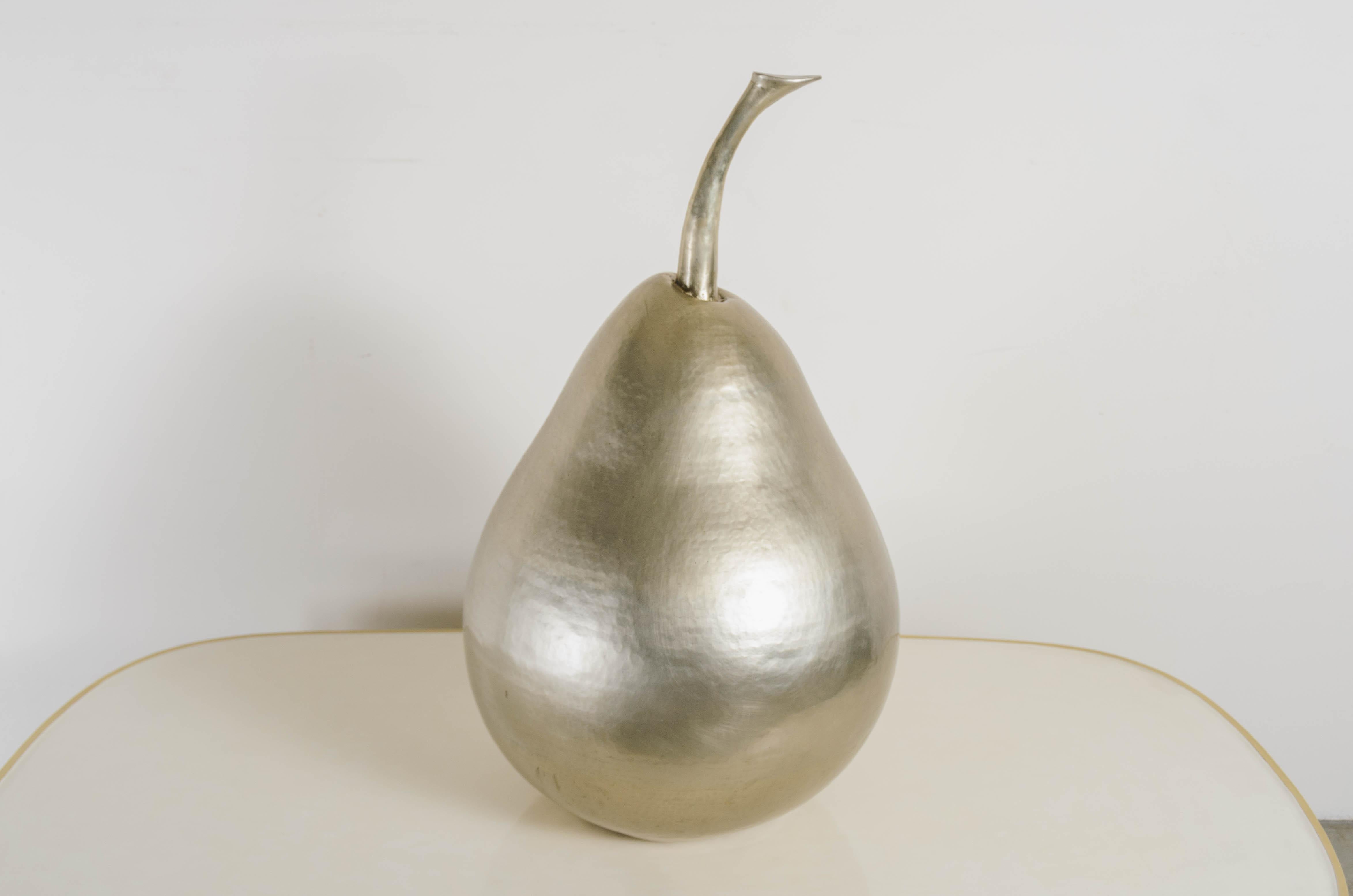 Pear sculpture
White bronze
Hand repoussé
Limited edition
Each piece is individually crafted and is unique. 
Repoussé is the traditional art of hand-hammering decorative relief onto sheet metal. The technique originated around 800 BC between