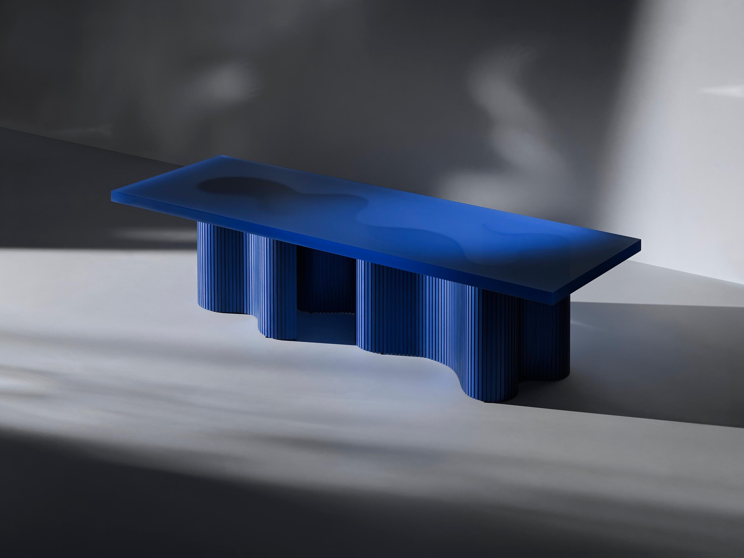 Spine is a series of tables consisting of two components, a thin aluminum sheet captured in
a cast resin surface. The series is a result of many material explorations concerned with bent forms and enhanced flexibility. 

The spine of each table