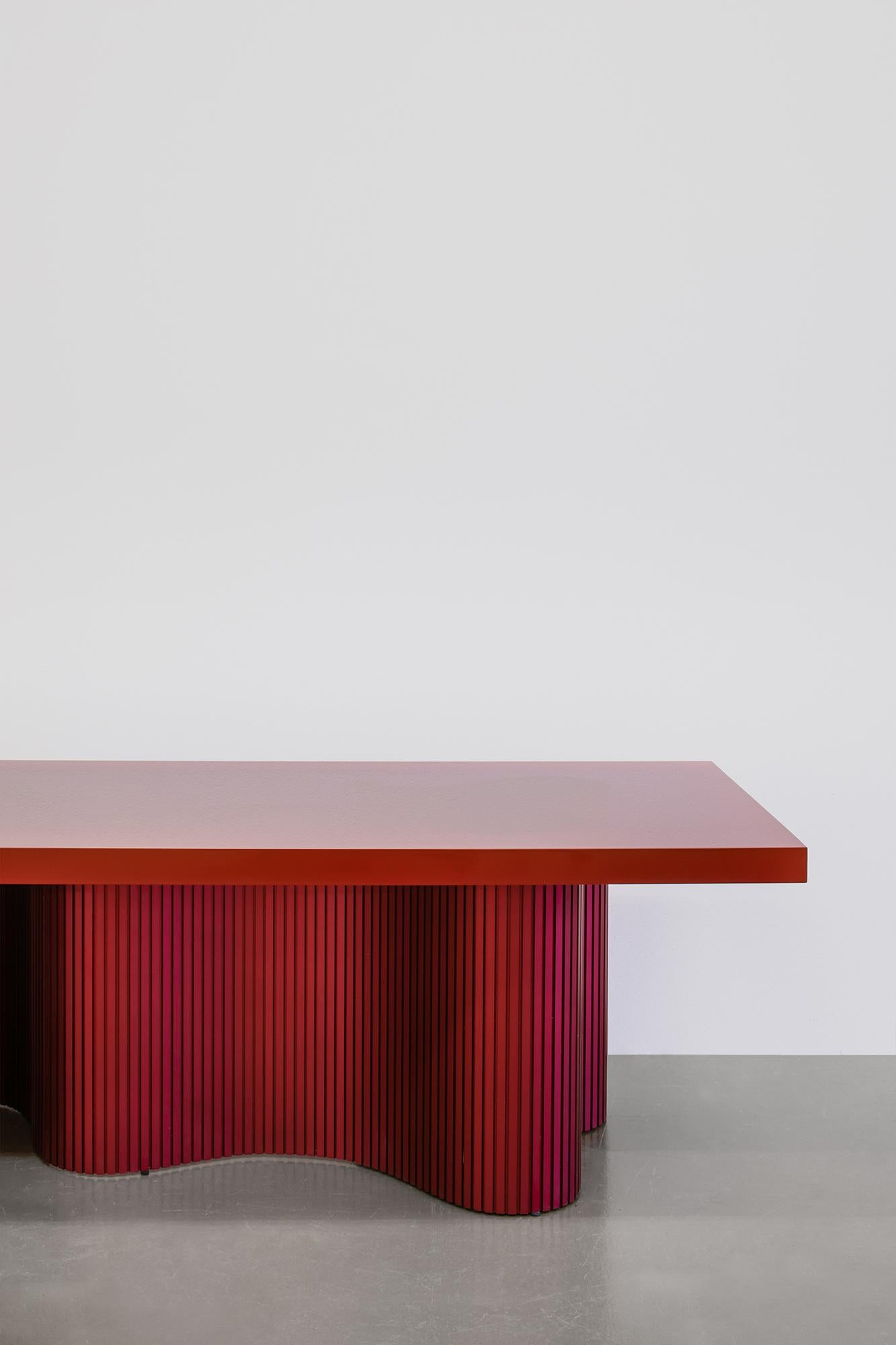 Spine is a series of tables consisting of two components - a thin aluminium sheet captured in
a cast resin surface. The series is a result of many material explorations concerned with bent forms and enhanced flexibility. 

The spine of each table