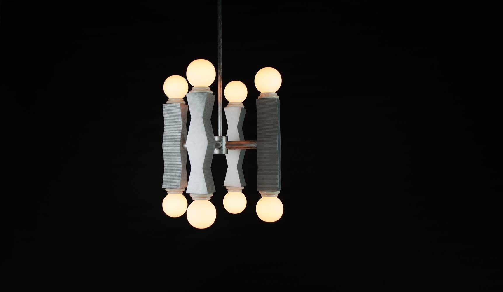 Contemporary Ridge chandelier is made from 4 cast aluminium columns composed into a cross formation with cream necks and matte globes. Each column is individually cast by hand highlighting the raw aluminium qualities. 

The geometric shapes echo