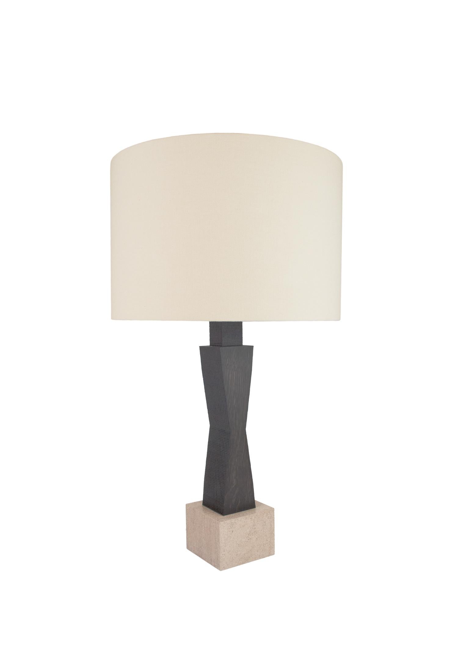 Expressing mass and material quality are common threads found in Jobst’s iconic collection. The Ridge lamp creates a striking silhouette that echo early 20th century design and sculpture. The geometric form of the oak base is contrasted with a