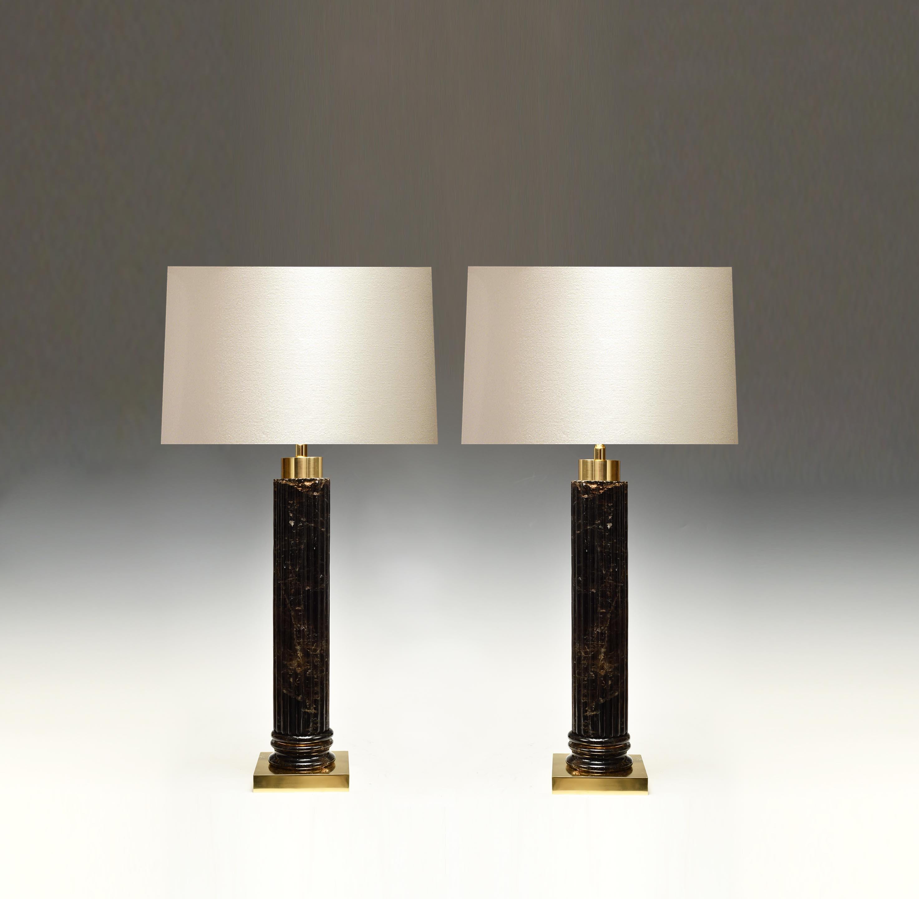 A pair of carved strips cylindrical smoky rock crystal lamps with polished brass bases. Created by Phoenix Gallery.
Each lamp installs two sockets.
To the top of rock crystal: 17