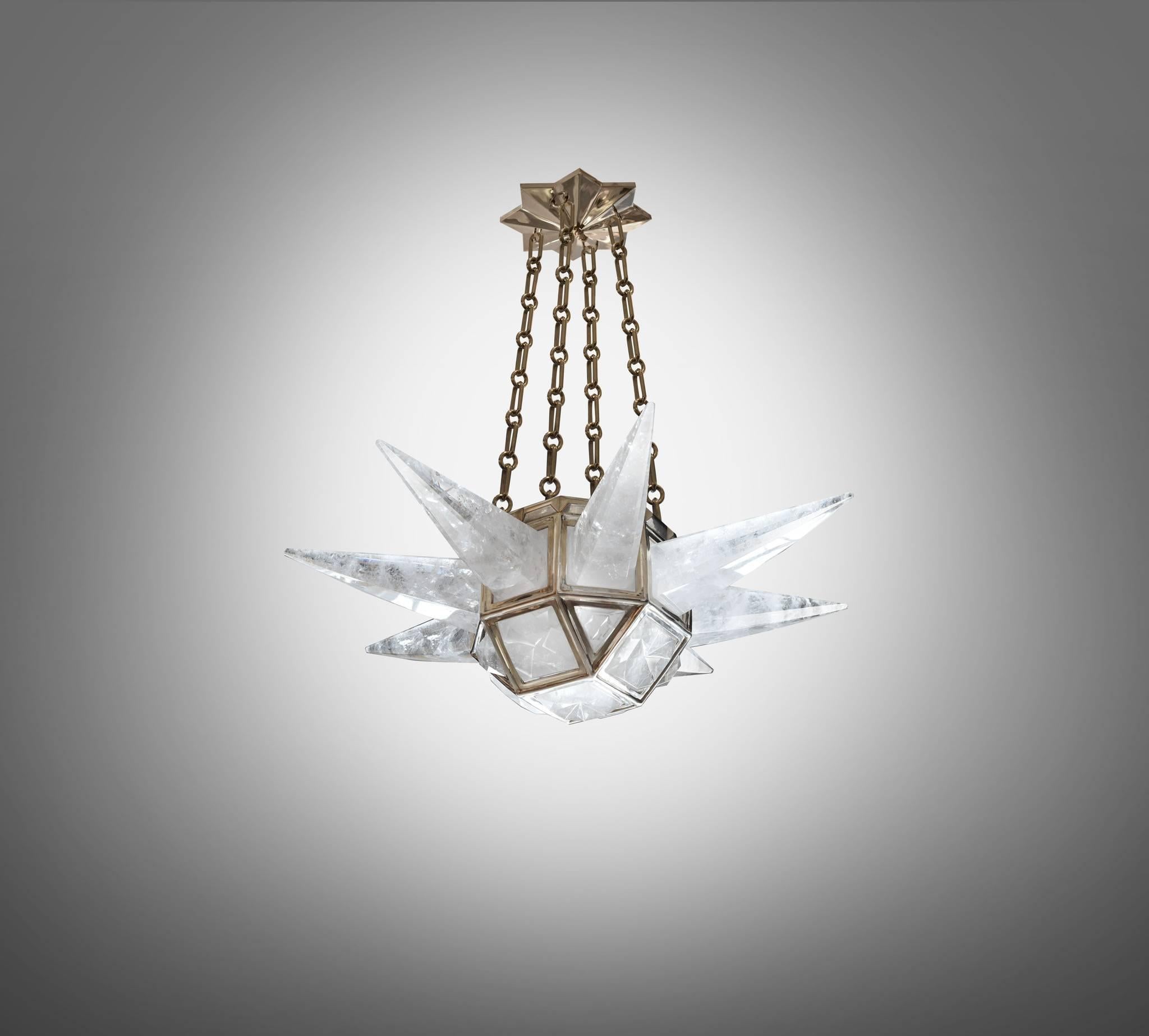 A fine carved contemporary rock crystal quartz chandelier with eight spikes, polished nickel finished frame, created by Phoenix Gallery, NYC.
Height can be adjustable.
Available in nickel plating and antique brass finish.

