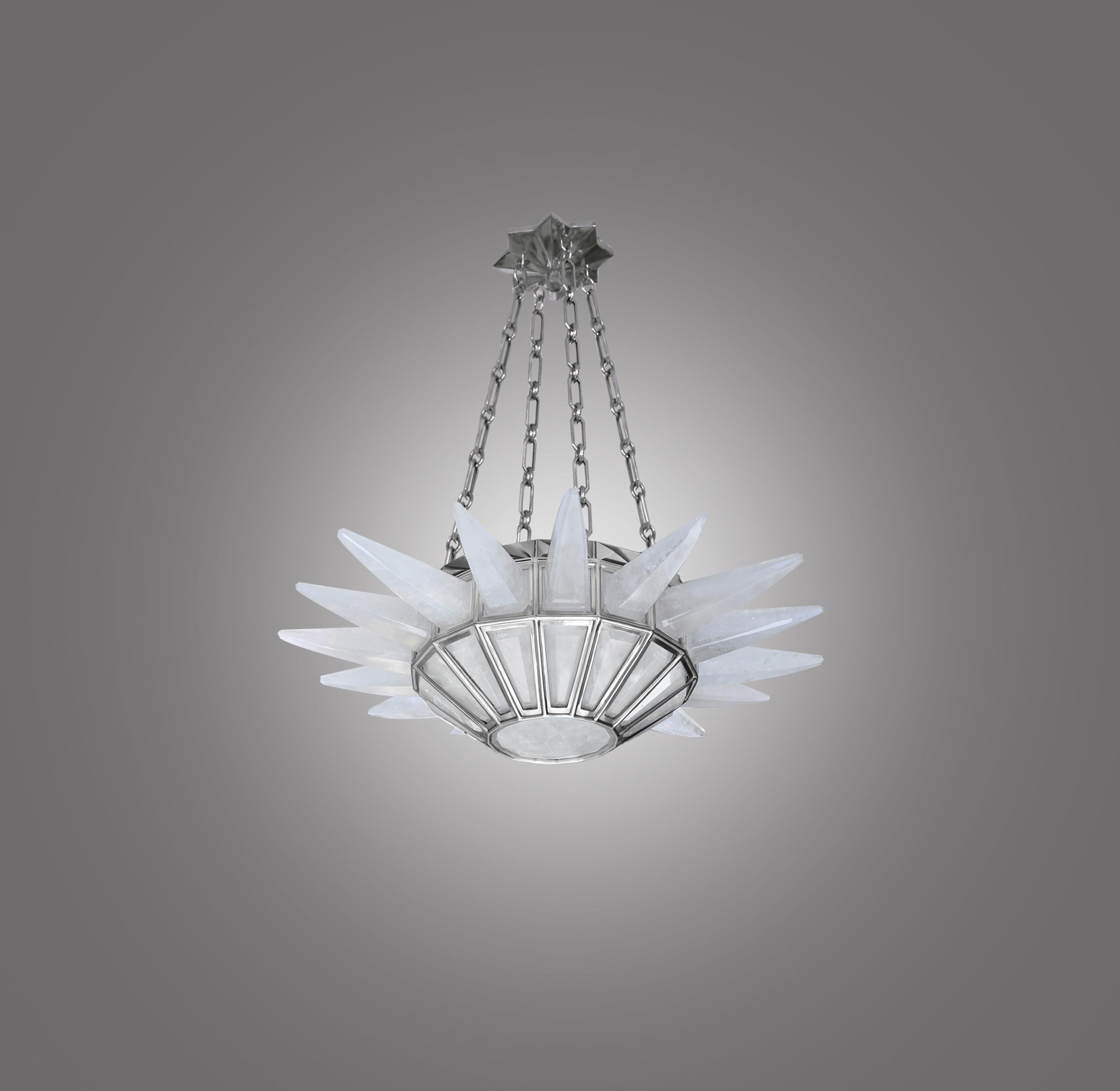A fine carved contemporary rock crystal quartz chandelier with 16 spikes, matte nickel finished frame. Created by Phoenix Gallery, NYC.
Custom size upon request.