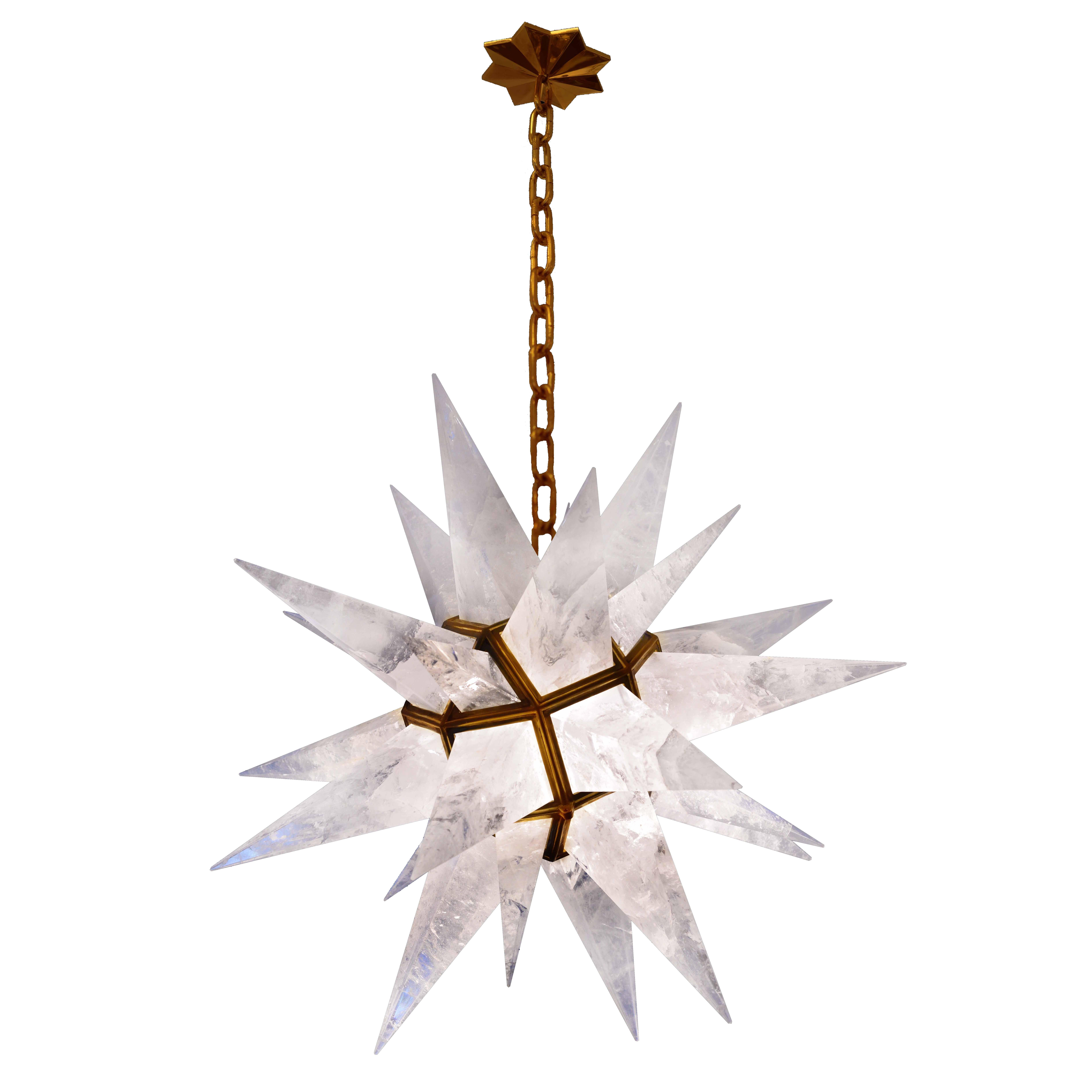 A fine carved star form rock crystal chandelier with antique brass finished frame, created by Phoenix Gallery.

Height can adjustable. 
Available in nickel plated frame. 
Available in 30