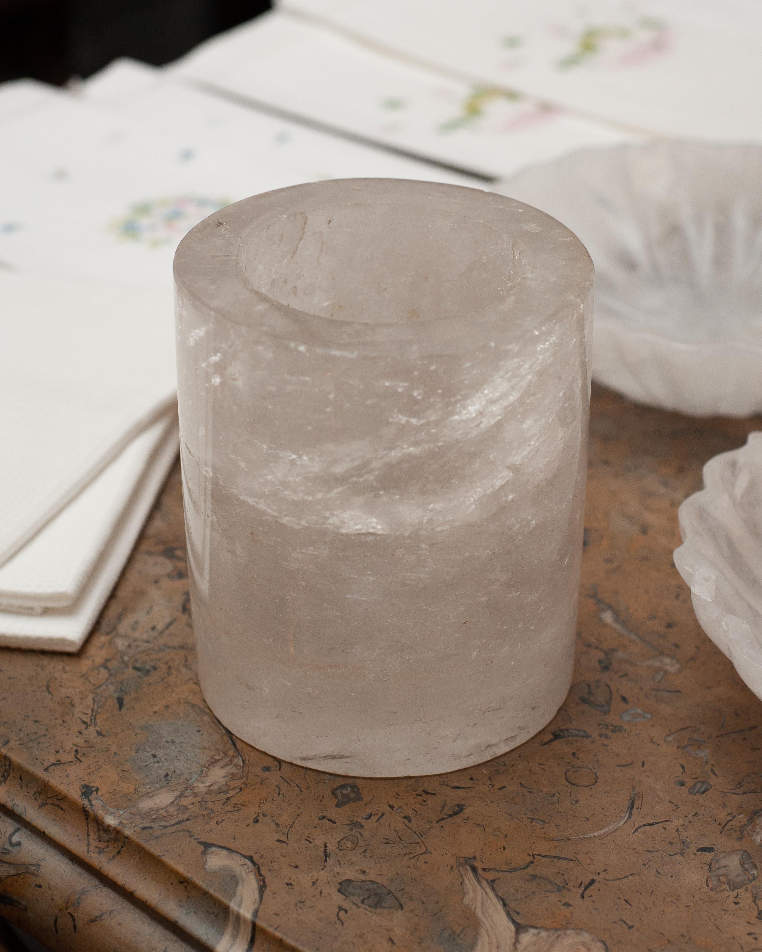 Bring the healing energy of rock crystal into your home with this carved votive. This thickly cut contemporary votive is simple and elegant, but beautifully made. Entirely solid rock crystal quartz, this translucent stone allows light to radiate out