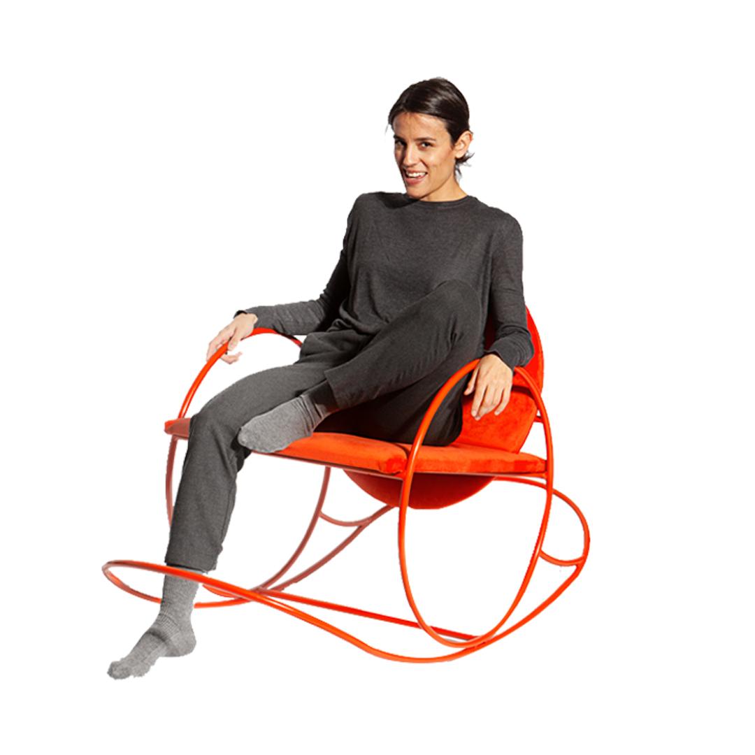 Contemporary rocking chair ”Meneo” designed by Ángel Mombiedro, with a structure made of metal, lacquered in Blood Orange with a seat and back upholstered in velvet.
 