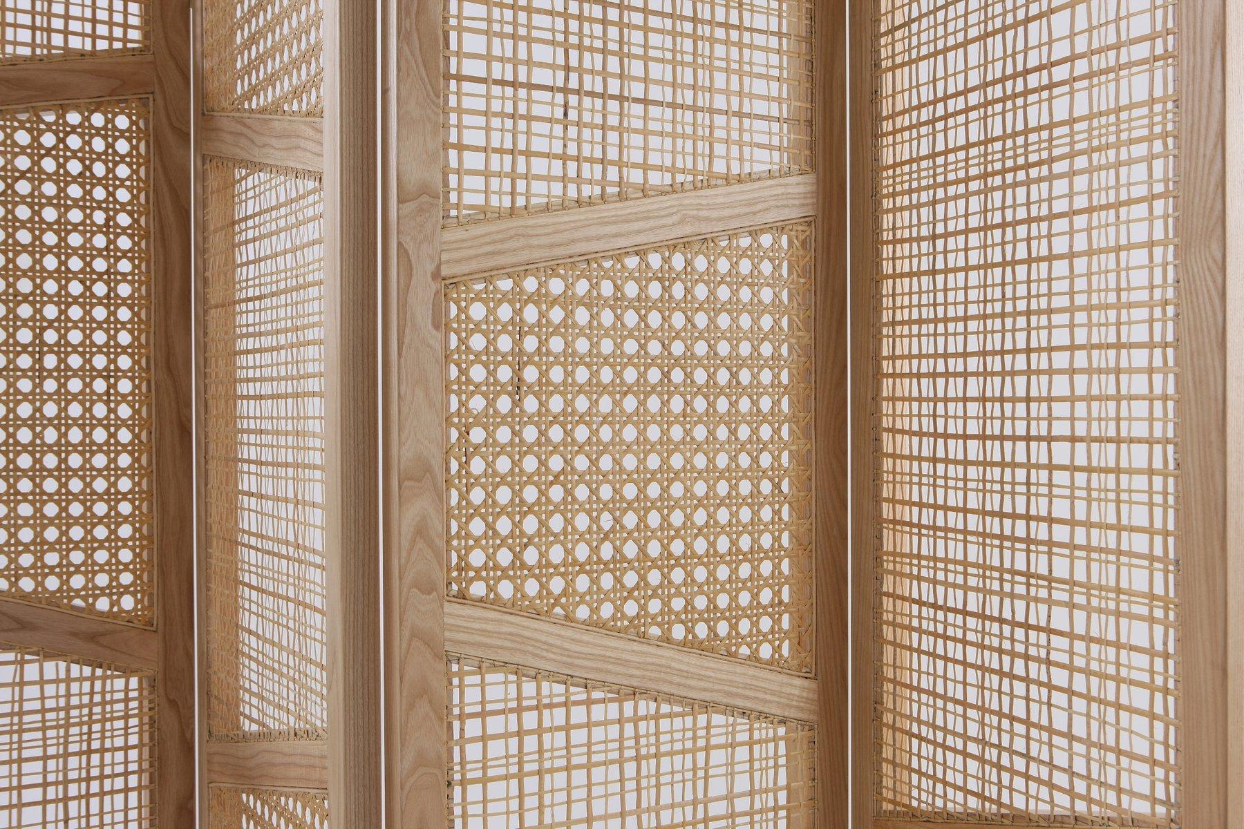 This midcentury style partition is defined by its striking angles and play on texture.
The handmade room divider filters light while maintaining privacy and a separation of spaces.
Material: Ashwood/straw
Color: Natural
Finish: Natural.
Please