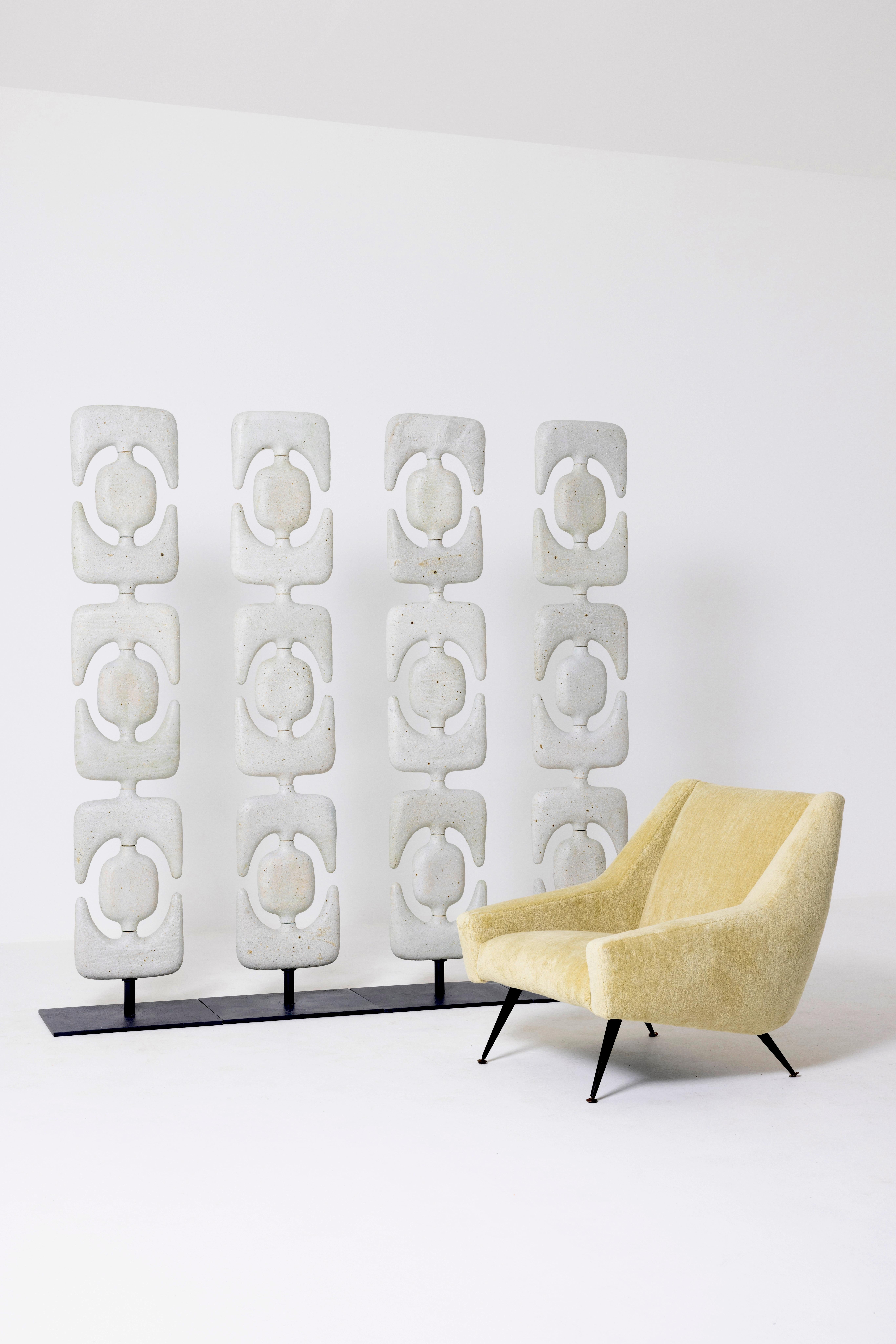 Natasha Dakhli
Totems/Room Divider, 2021
Material: Stoneware, white enamel
Dimension; H 185 x 163 x 52 cm

Modular totems sculptures made of white enamelled stoneware featuring abstract shapes that feel talismanic and mysterious in their