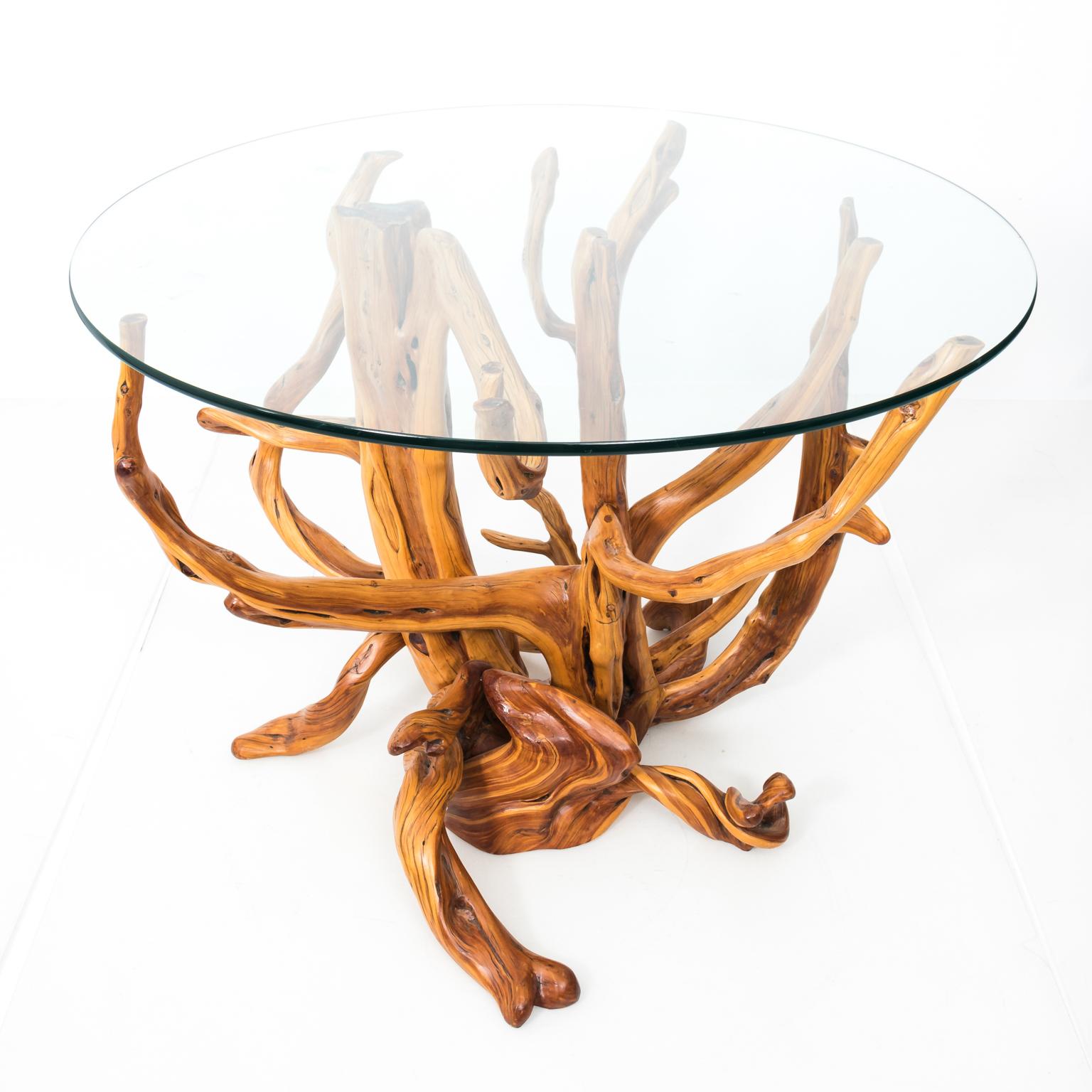Circa late 20th century custom made glass top center table with root wood base. Signed by Montana based craftsman Lee Kern. Please note of minor scratches due to wear with age.
