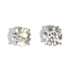 Orecchini contemporanei con diamante taglio brillante rotondo in stile borchia in oro giallo 9 carati