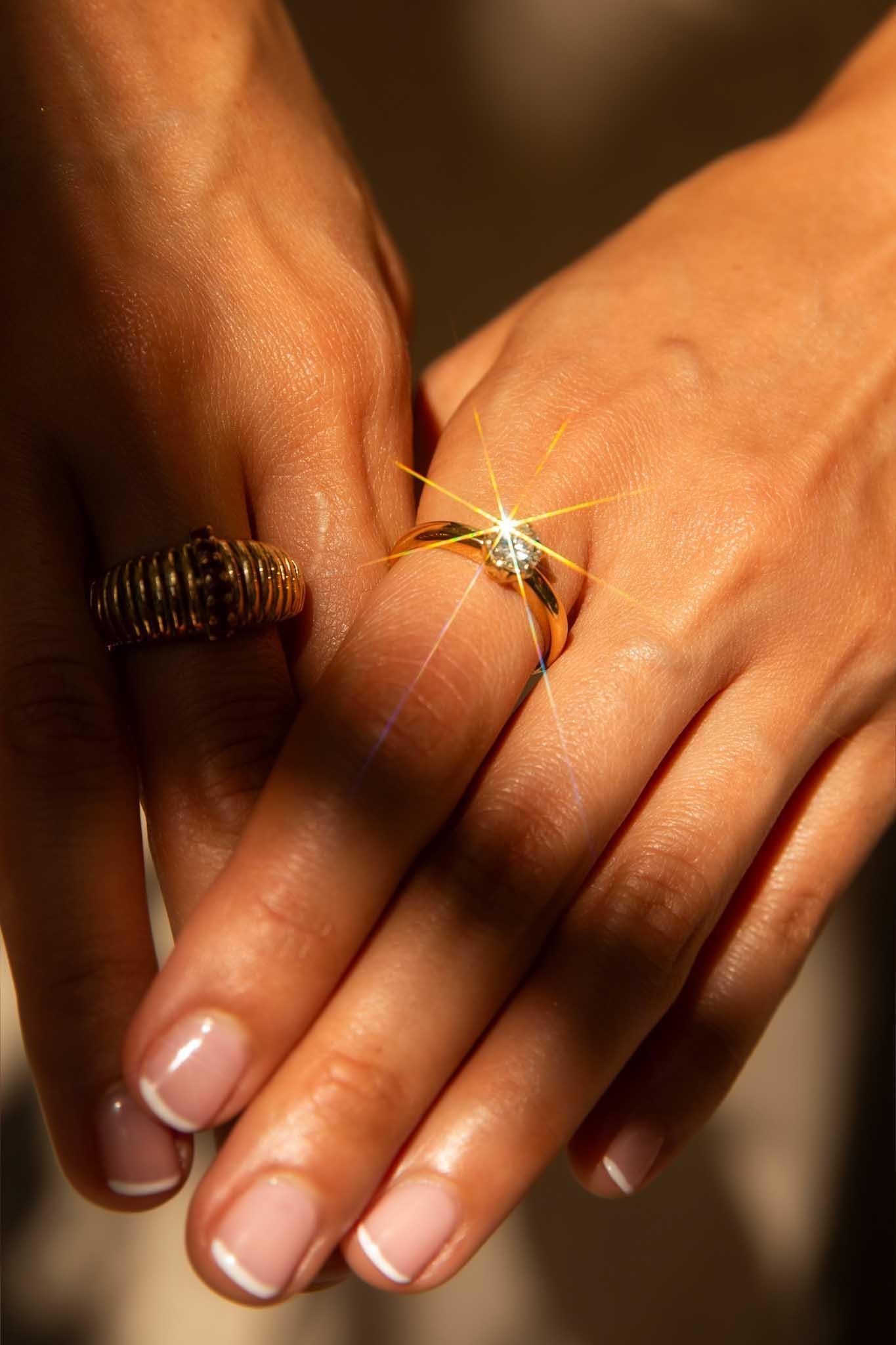 When the simplest of design offers the greatest of reward we have The Antonia Ring. Her single diamond embraces the light, a symphony of brilliance that mirrors the sun's golden rays. Crafted beautifully in 18 carat yellow gold she is a promise of