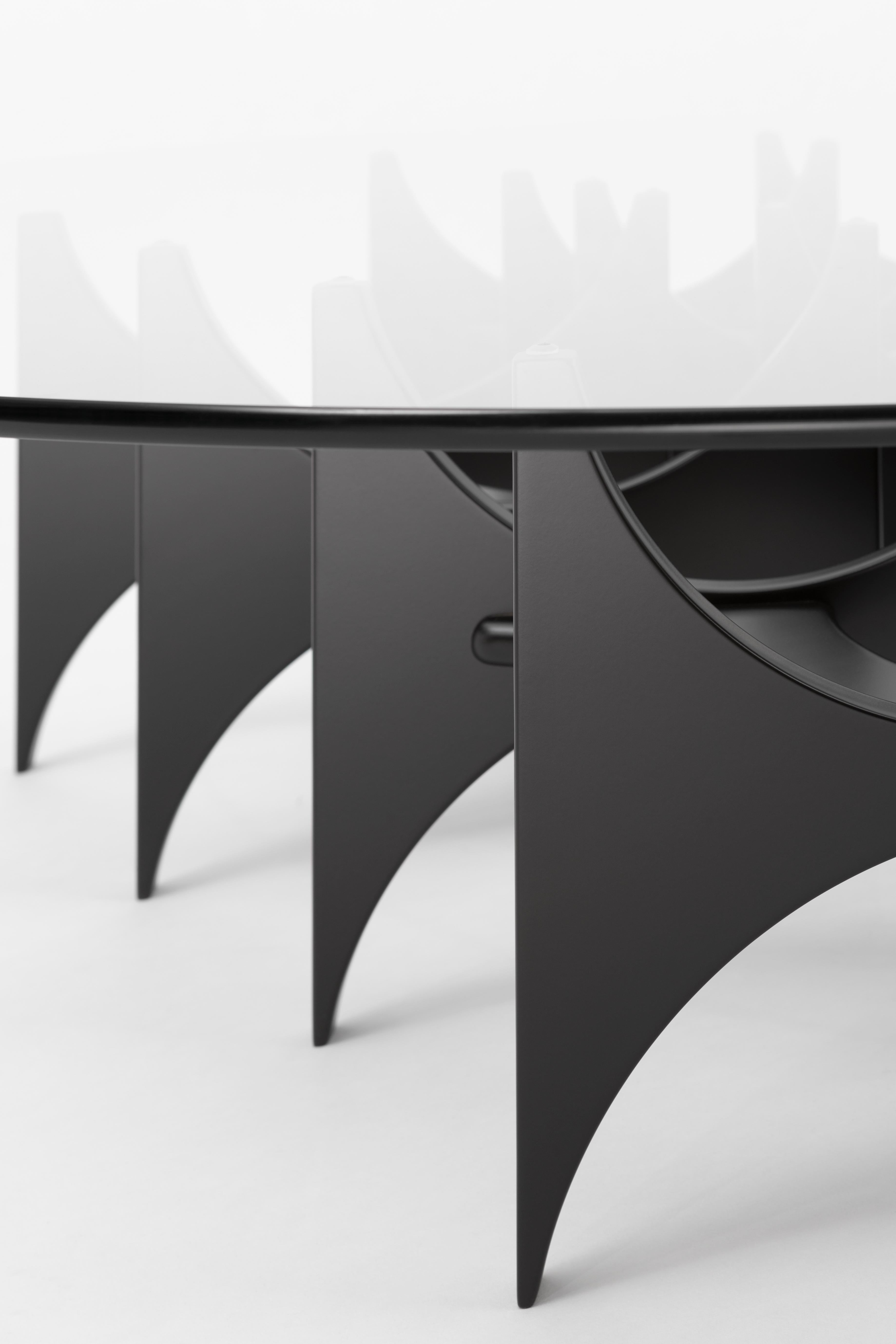 The 'Butterfly' coffee table is also a new entry to the 'Paesaggio' collection. Hannes Peer translated the biomorphic aesthetic of his 'Butterfly' console into a low table with equally distinctive organic forms. The top is made of tempered glass,