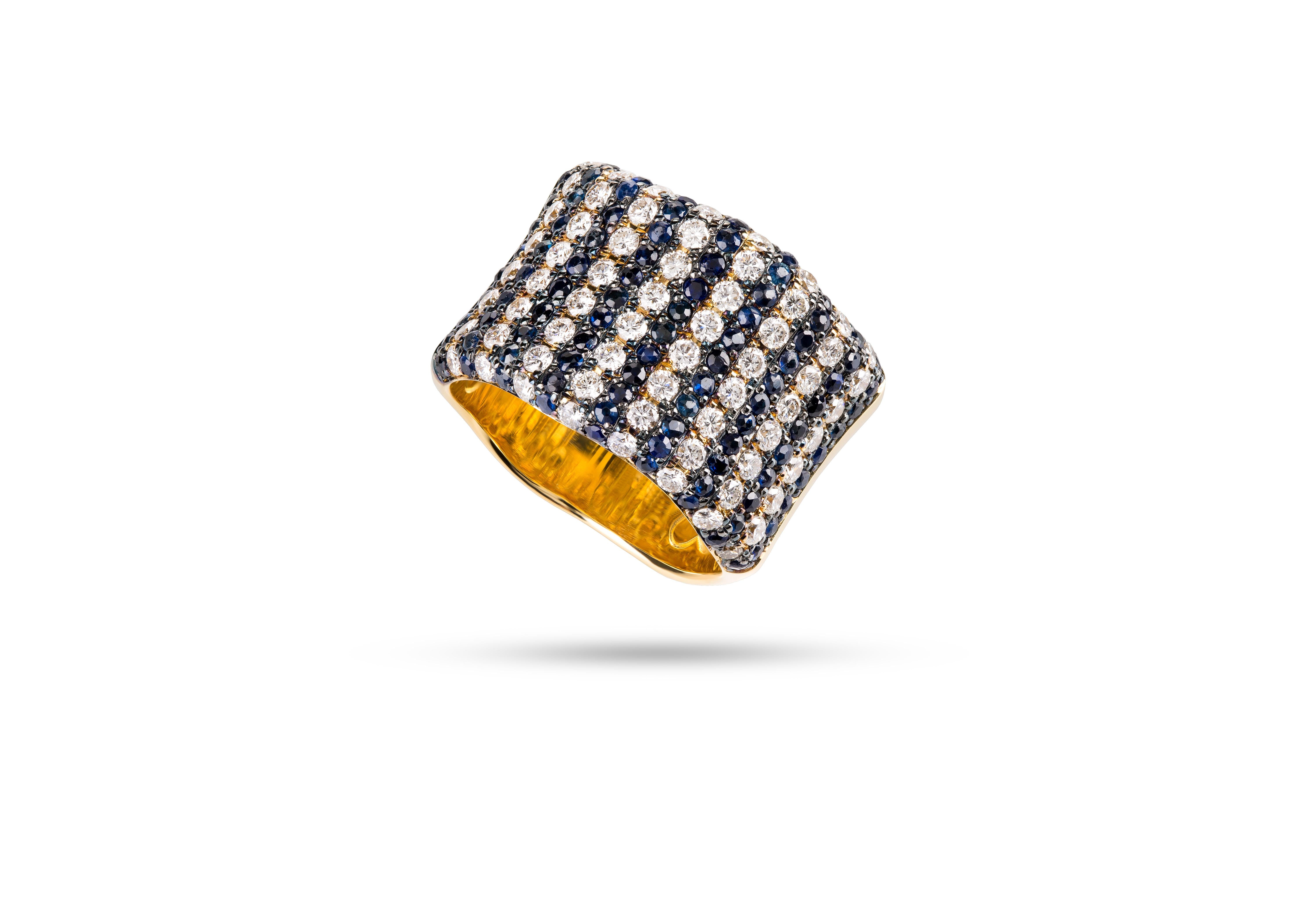 Rosior Contemporary Ring Manufactured in 19,2k Yellow Gold and setted with:
- 94 blue sapphires with 1,19ct,
- 64 white (G-VVS) diamonds with 1,21ct.
Black rhodium finnishing.
Unique piece accompanied with its own certificate of
