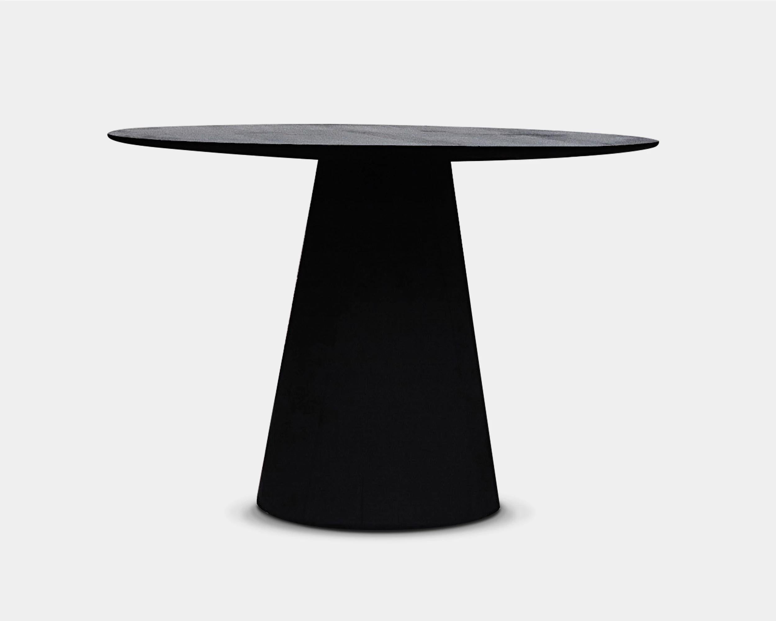 Customizable round dining table AMOK by Camilo Andres Rodriguez Marquez (aka CarmWorks)

Solid oak or cedar / Burnt wood or natural 
Standard size: H76 x 100 cm (customizable) 

Each piece is made to order and hand crafted by the artist.