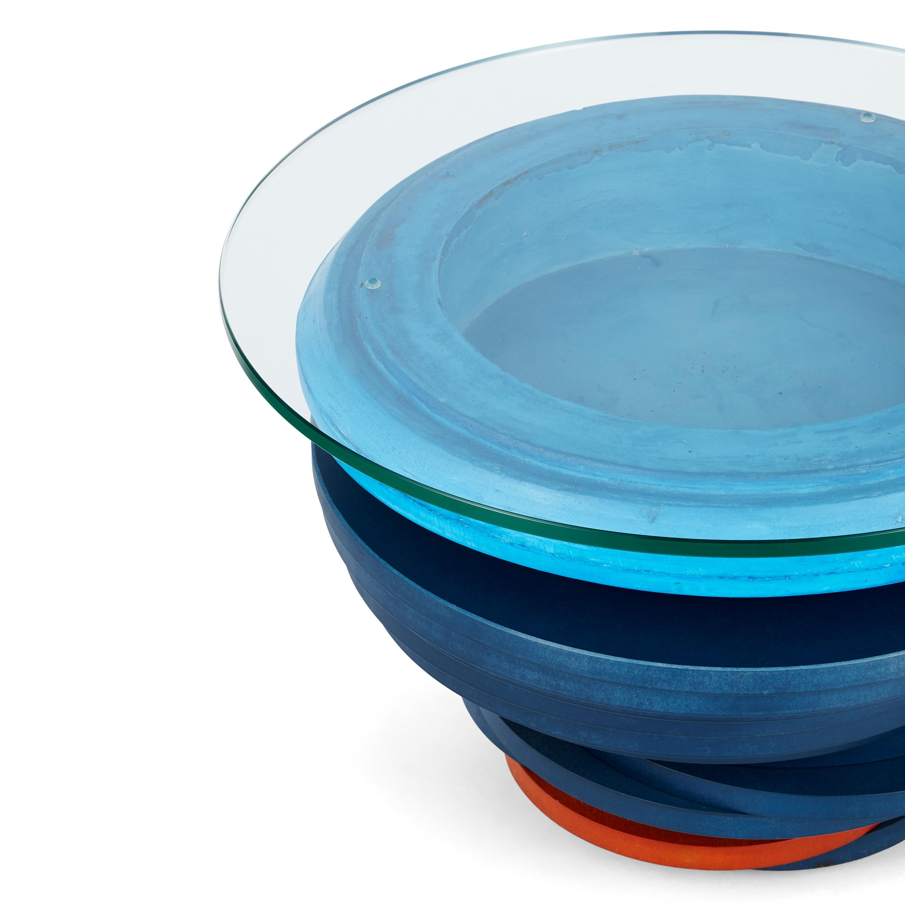  Despite its modular composition of structure, shape and materials, the Asanka Coffee Table represents the unification of traditional Ghanaian proverbial symbolism and modernity. 

The jesmonite bowl of this coffee table is inspired by the ‘Asanka’