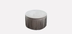 Contemporary Round Leather Ottoman with Fringe Detail