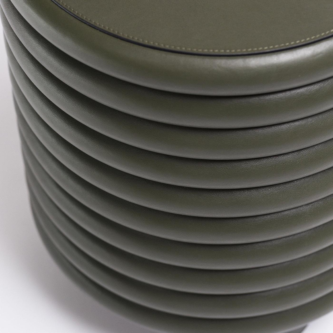 Contemporary round leather stool Scala by Stephane Parmentier for Giobagnara.
The object presented in the image has following finish: F02 Loden Green Nappa Leather

Part of the Scala Collection of furniture pieces, this stool is characterized by