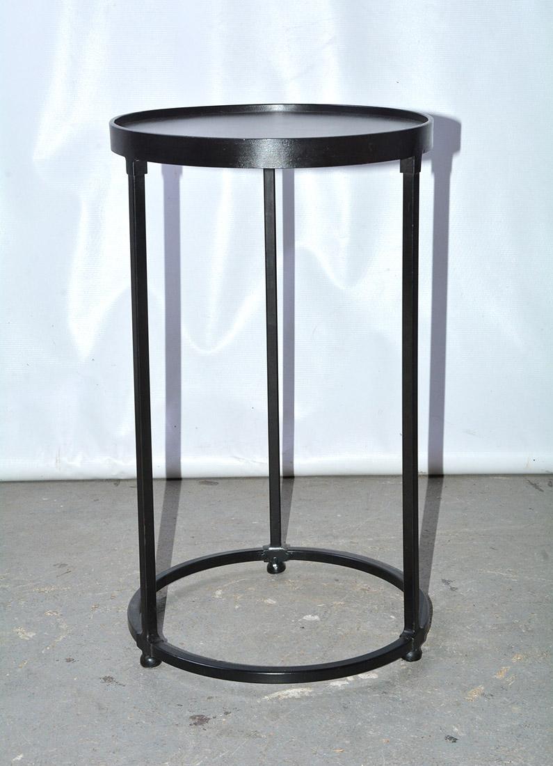 Contemporary black iron round side table. Table has padded feet. Works well on a porch or terrace as end table or occasional table. A larger matching table can be used as stacking tables by sliding the smaller unit under the taller one.

Taller