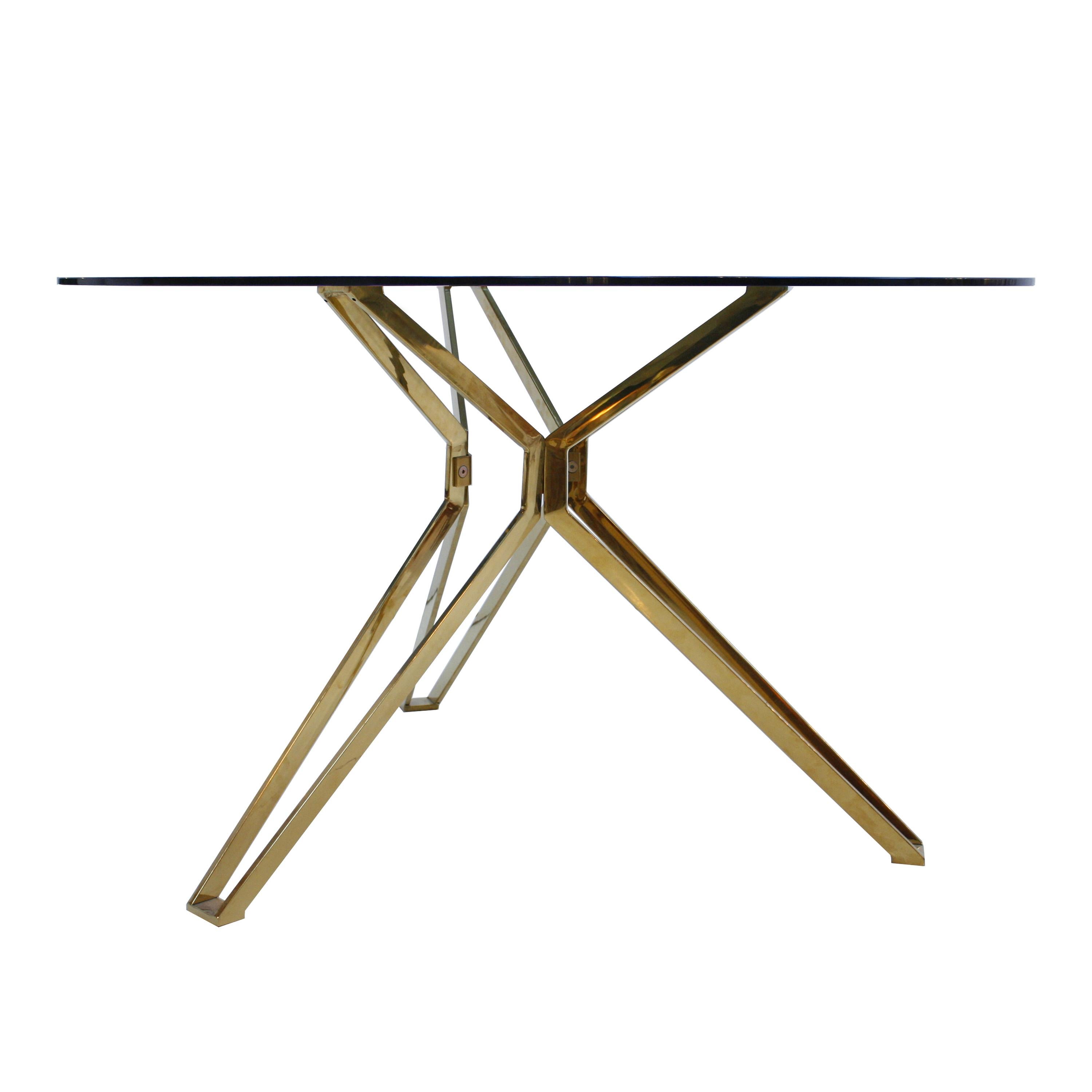 French contemporary dining table made with a sculptural brass base completed with a circular smoked glass top.
