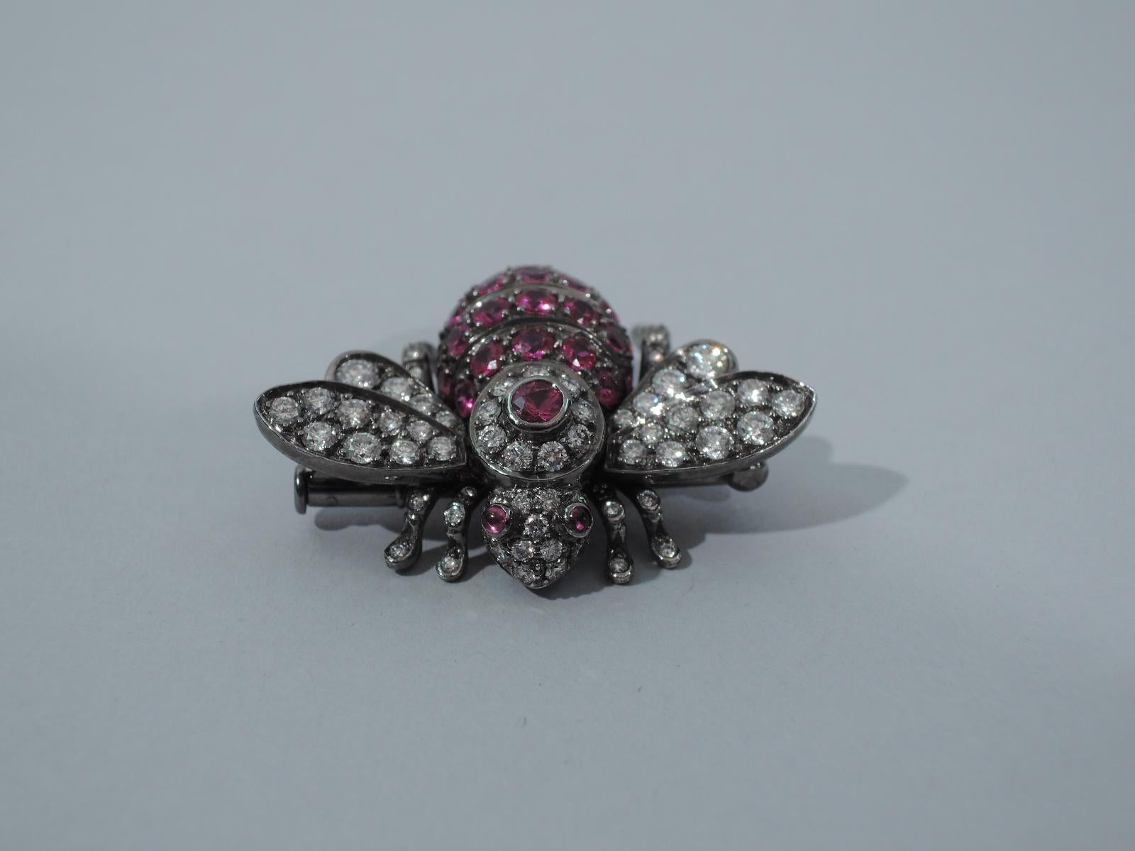 A fabulous 18K white gold bee brooch inlaid with diamonds and rubies. Made by Sabbadini in Milan, ca. 2000. Signed.   

Dimensions: L 1 3/8 x W 1 x H 1/2 in. 