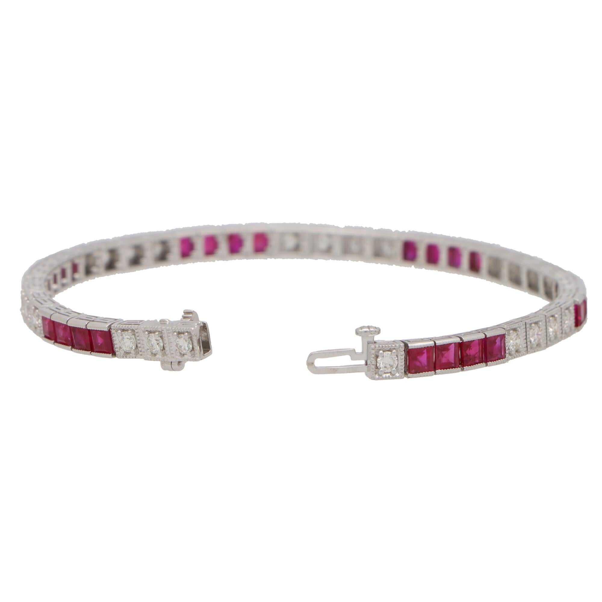  A beautiful contemporary diamond and ruby line bracelet set in 18k white gold.

The bracelet is composed of a grand total of 24 round brilliant cut diamonds and 24 square cut vibrant ruby stones. All of the stones are securely pressure and claw set