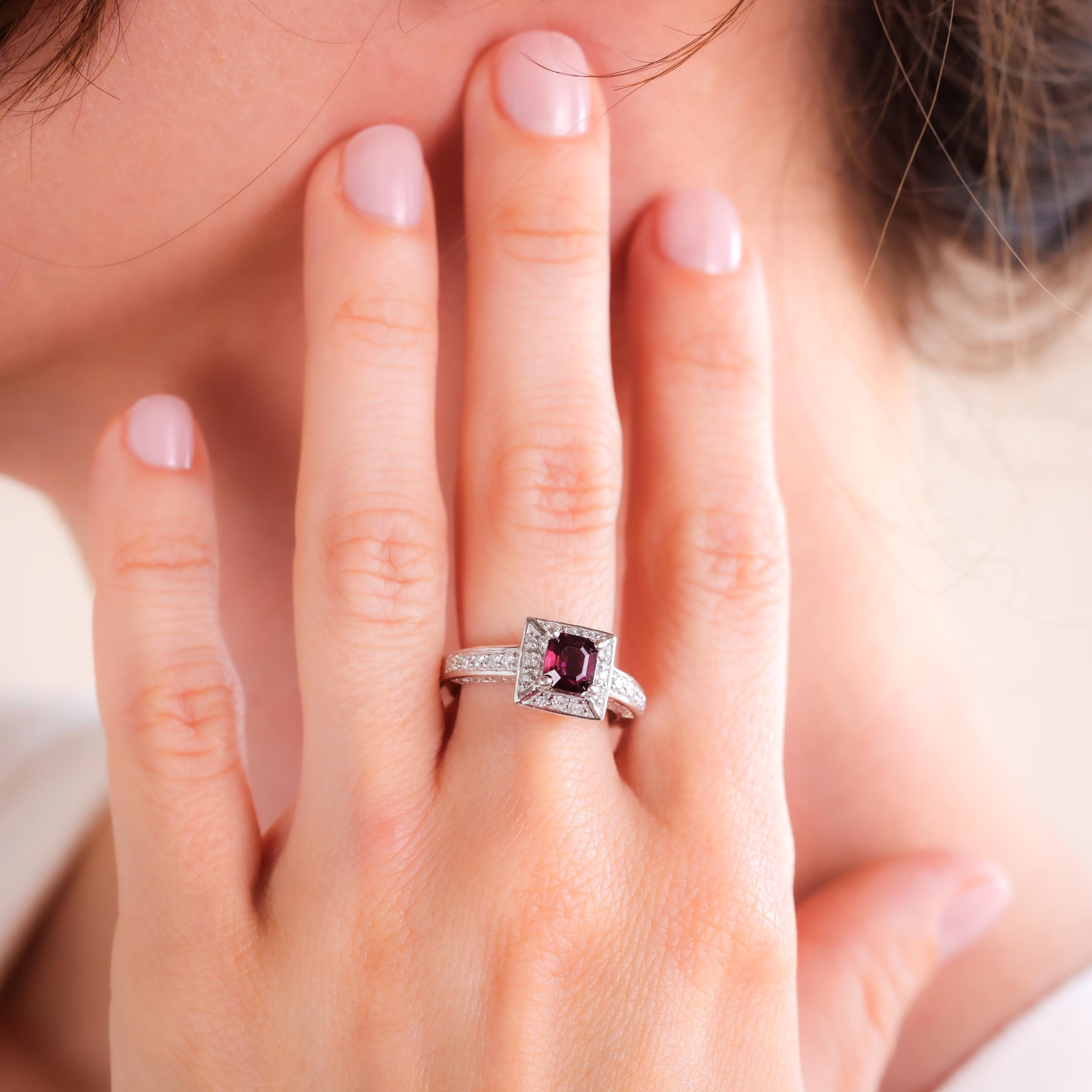 Center Stone: Ruby
Cut: Asscher
Weight: Approximately 1 Carat
Color: Red
Accent Stone: 76 Diamonds
Cut: Round
Weight: Approximately 1.00 Carats
Color: E
Clarity: VS2-SI1
Metal: 14K White Gold
Era: Contemporary
Circa: 2000s
Hallmarks: 14k Purity
