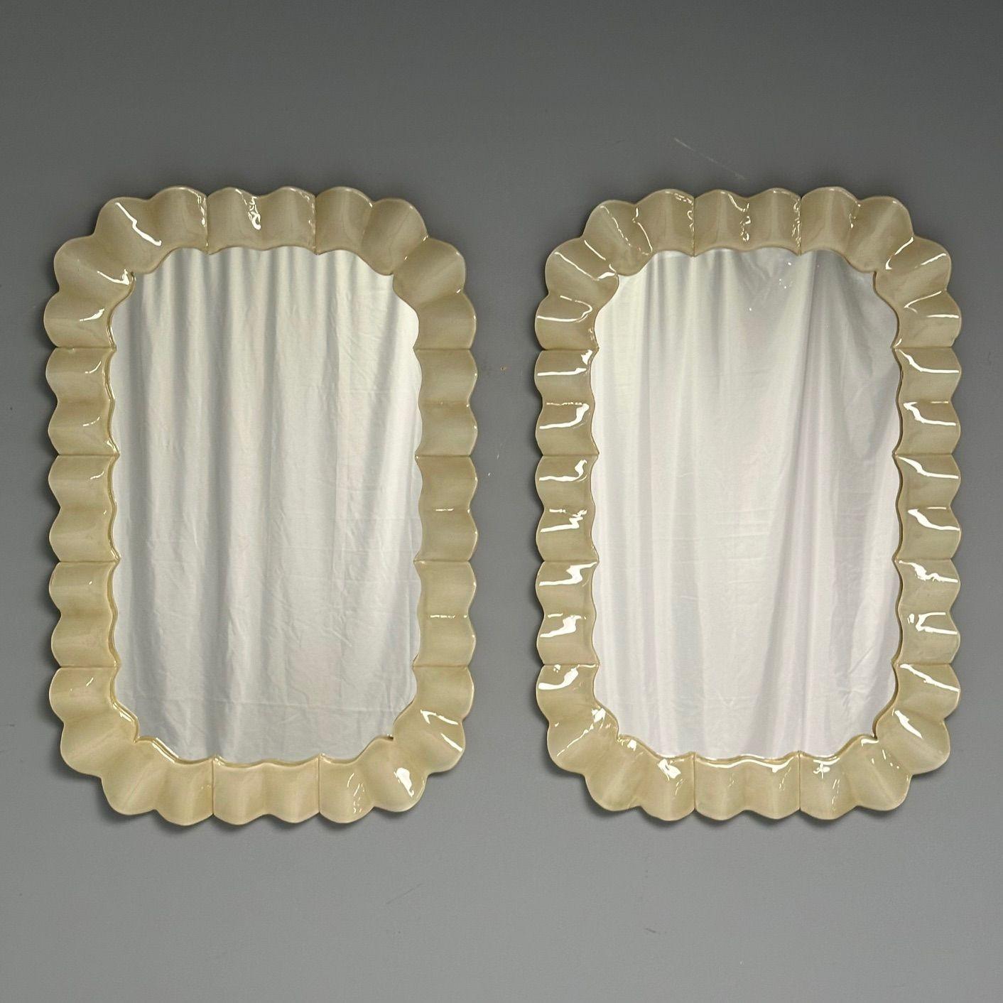 Contemporary, Wall Mirrors with Ruffle Motif, White Murano Glass, Brass, Italy, 2023

Pair of rectangular wall mirrors with ruffle motif designed and produced in Italy. Each mirror has a wavy white Murano glass frame and holes on the back to be hung