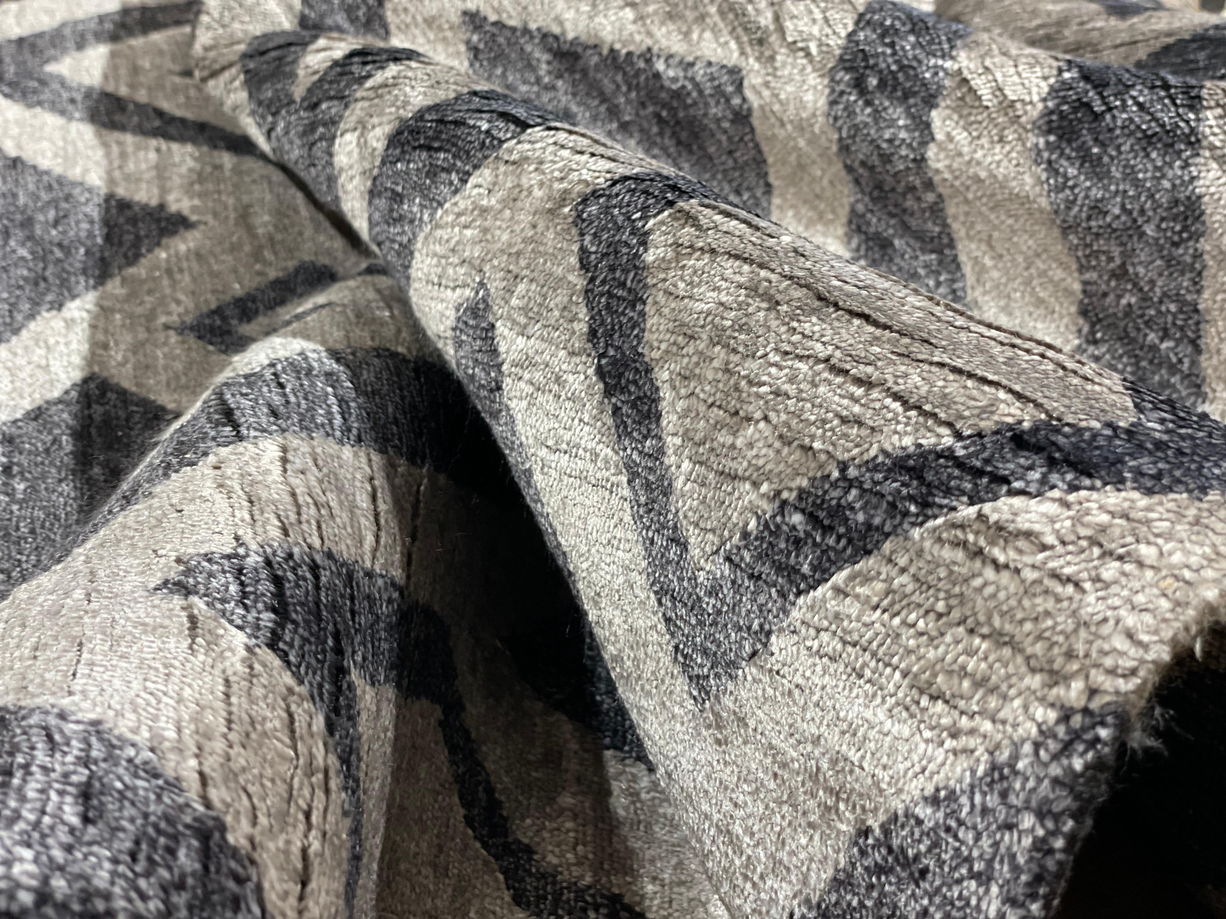 A beautiful contemporary modern design, hand knotted using hand spun botanical bamboo silk by Djoharian Design.

This hand-knotted rug with an organic design and wonderful color combination from gray and charcoal has the look a modern room requires.